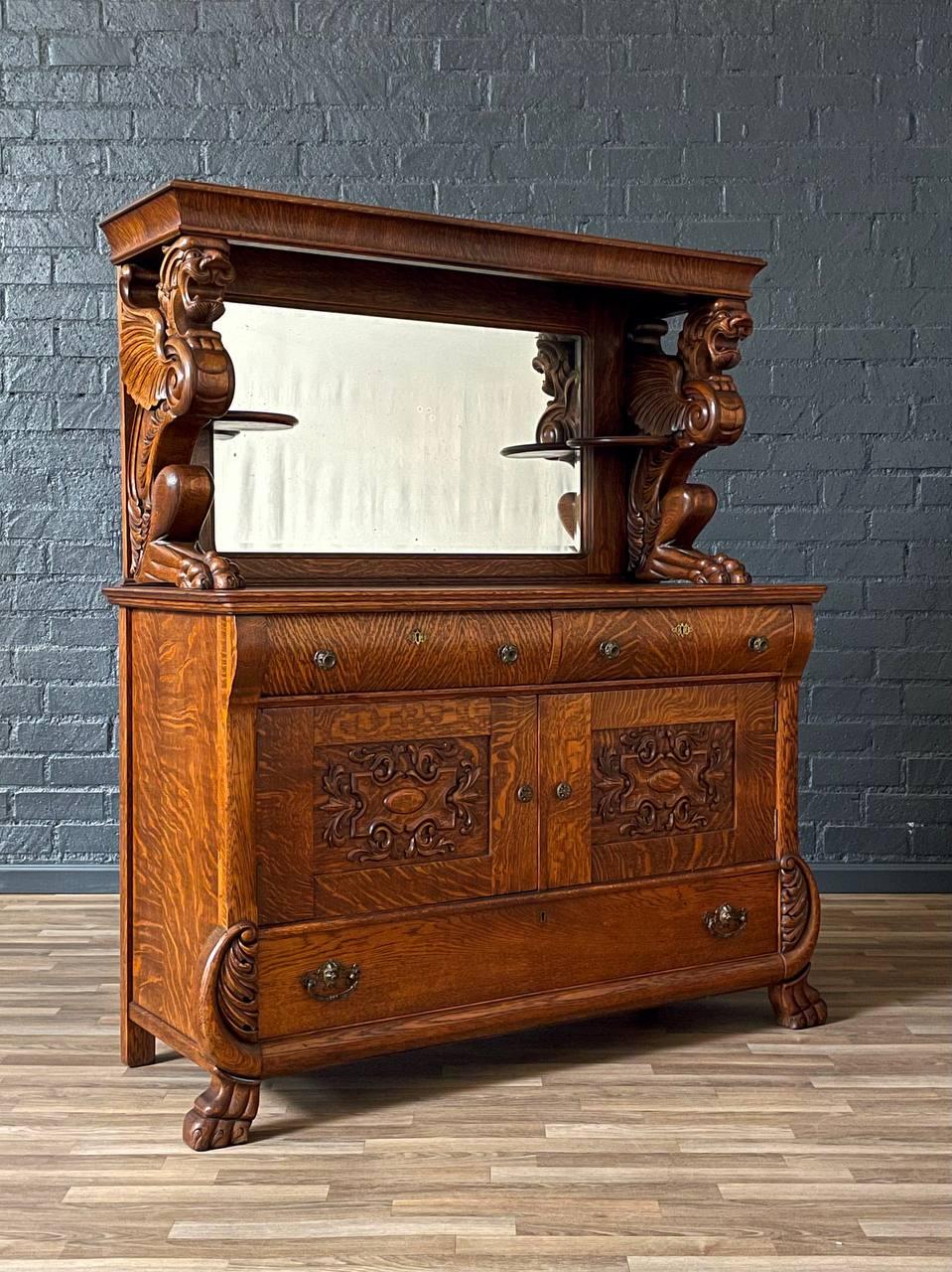 Condition: Original Vintage Condition
Materials: Quarter-Sawn Oak, Original Mirror Glass

Dimensions: 
63.50”H x 53.25”W x 23.50”D
Table Height: 36