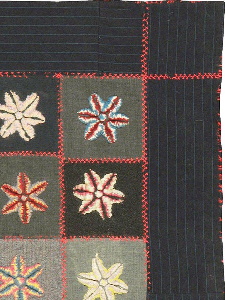 There is no overarching color composition to either the square sections nor to their associated six-point stars on this richly toned antique quilt. The stars are not perfectly oriented, either, tilting, standing on one or two legs, and generally