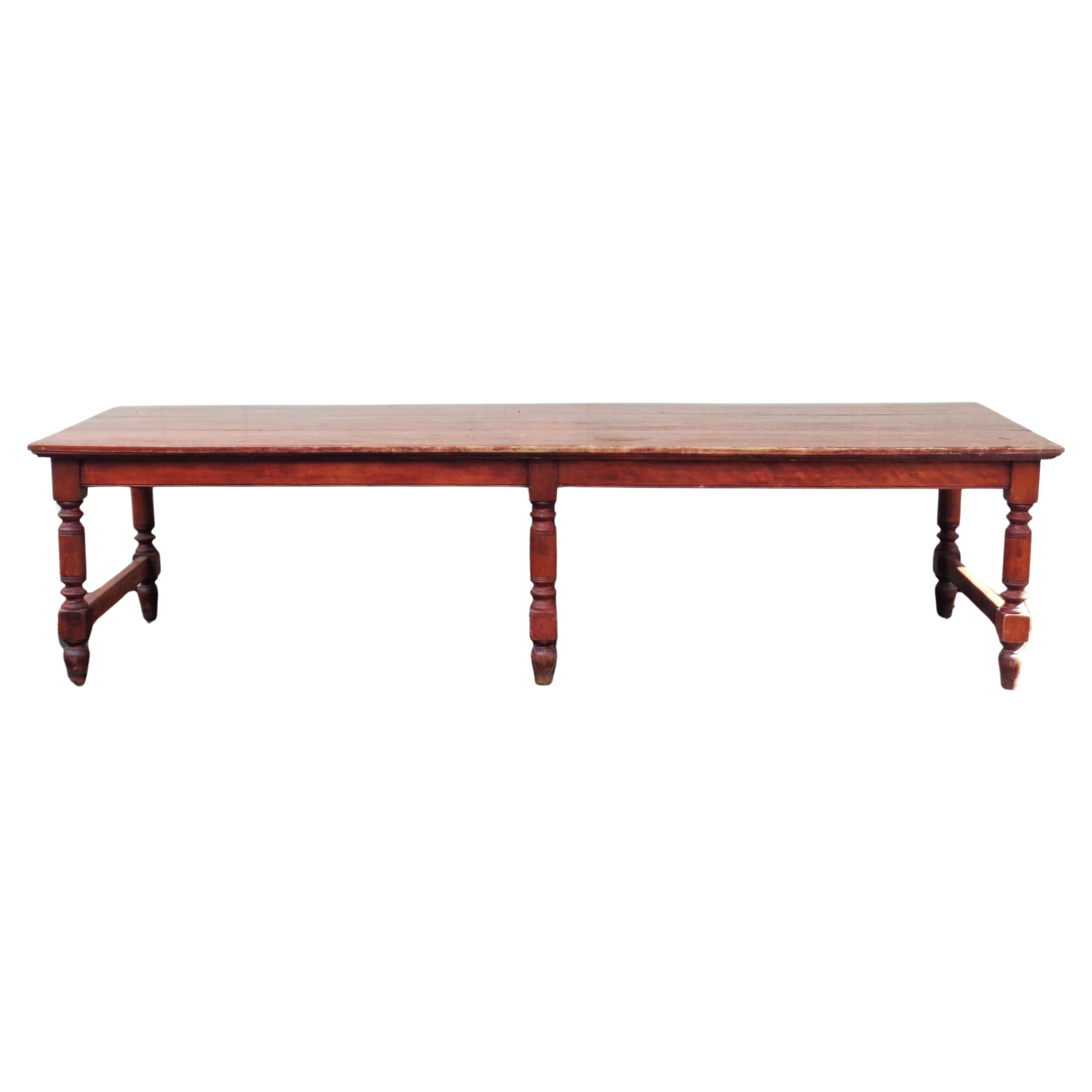  Antique American banquet dining table. Constructed of hardwood maple in the original stained finish with six well defined turned legs joined by bottom stretchers at each side and at center. Circa 1870-1880. Measures 120 inches wide x 41 inches deep
