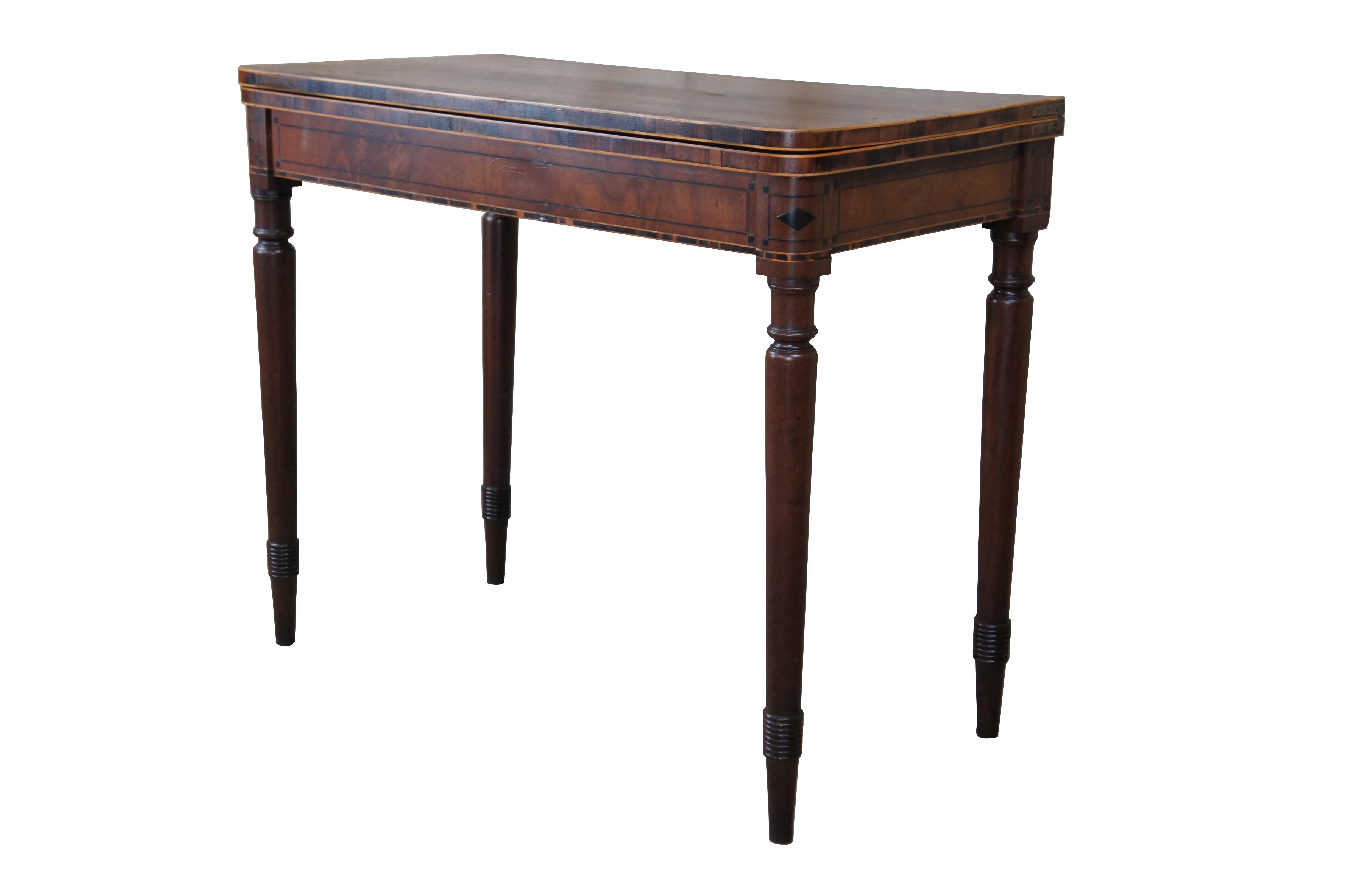 A Very Fine American Federal Period Game Table, c. 1820s.  Made from Mahogany with flame / crotch veneer, cross banding and ebonized inlay.  Opens to a felt game surface, supported by rear spider gatelegs.  Each leg is beautifully turned and tapered