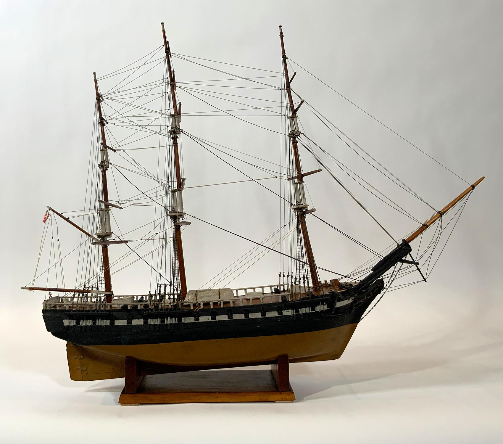 Antique ship model of an American warship. Scribed deck, cabins, hatches, companion way, etc. The model is rigged with full standing and running rigging. Set on a wood cradle.

Weight: 6 LBS
Overall Dimensions: 31” H x 38