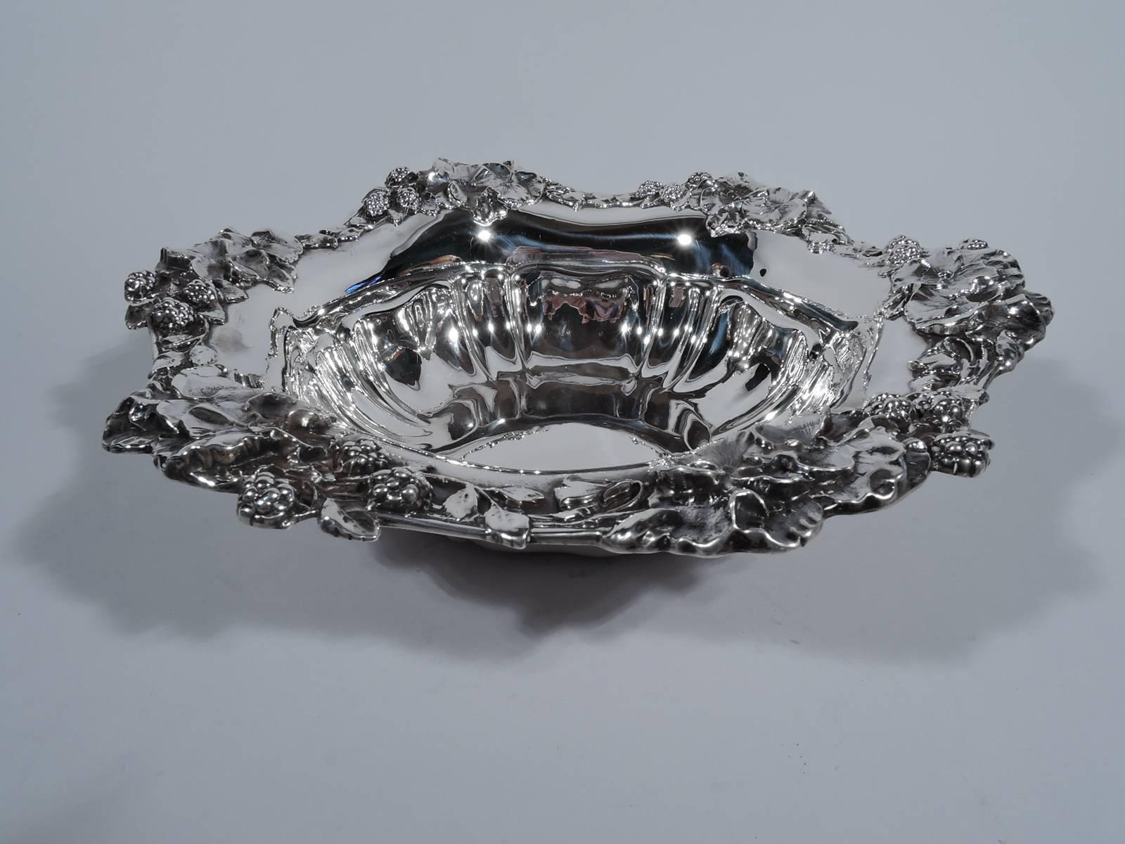 Art Nouveau sterling silver berry bowl. Well interior has alternating narrow and wide flutes. Wavy 6-point rim with applied blossoms and fruiting berry branches. Dense and succulent. Hallmarked R. Wallace & Sons, a Wallingford, Connecticut maker,