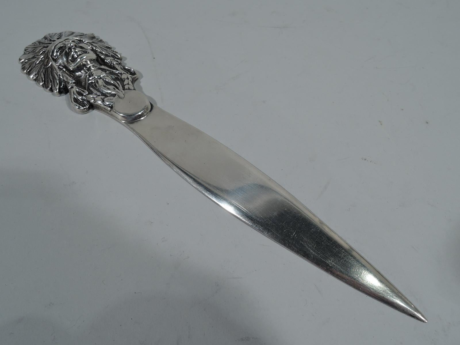 Antique sterling silver letter opener. Cast terminal in form of Indian chief with feathered headdress and intense, gaunt face. A nice piece of turn-of-the-century Native Americana. Hallmarked “Sterling 97”. Strong definition. Weight: 6.4 troy ounces.