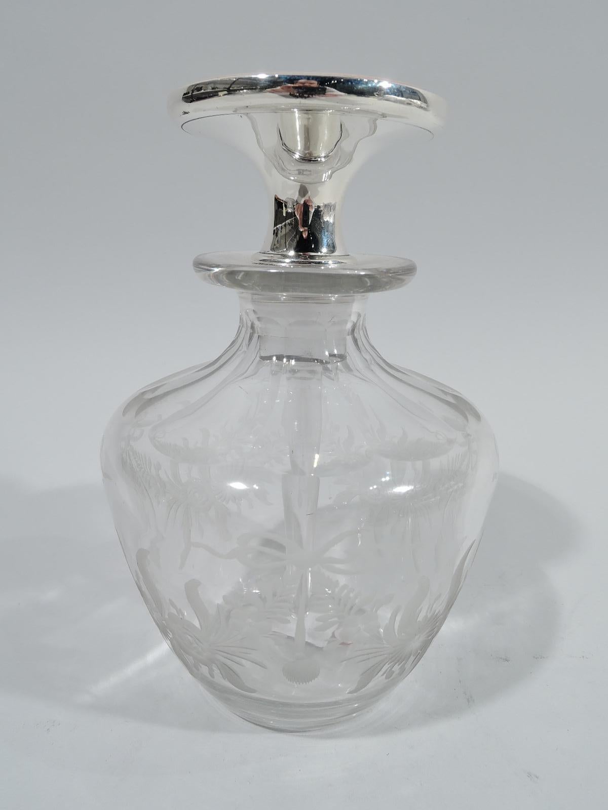 American Edwardian crystal perfume bottle with sterling silver and enamel stopper, ca 1910. Ovoid body with faceted shoulder and acid-etched floral garland. Stopper has flat top with concentric pink guilloche enamel and sterling silver neck; glass