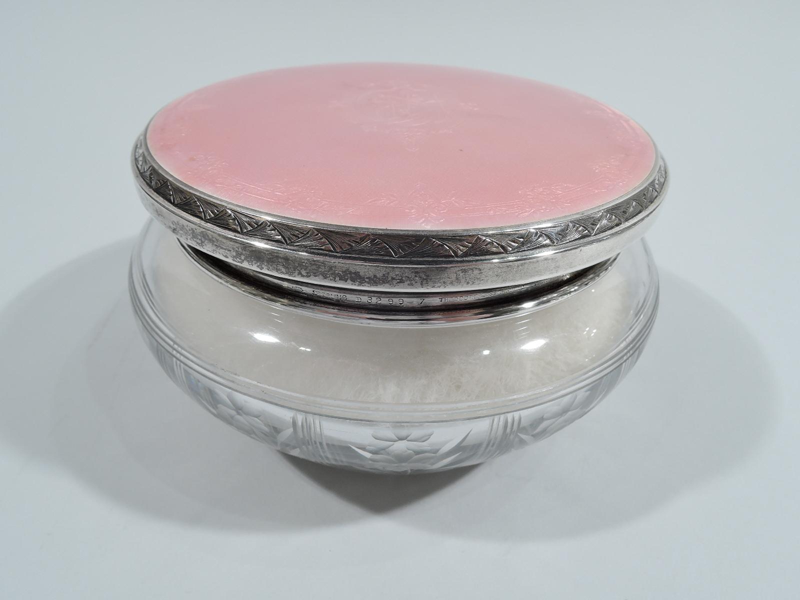 Edwardian crystal powder jar with sterling silver and enamel cover. Made by William B. Kerr in Newark, ca 1910. Round and tapering with acid-etched stem flowers in engraved rectilinear frames and short straight neck. Cover has sterling silver sides