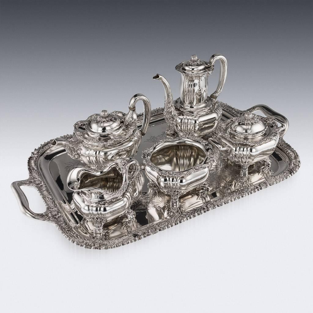 Antique late 19th century American rare and magnificent five piece tea and coffee service on tray, comprising a coffee pot, teapot, covered sugar bowl, waist bowl, cream jug and massive tray, each piece on four chrysanthemum-clad feet, with fluted