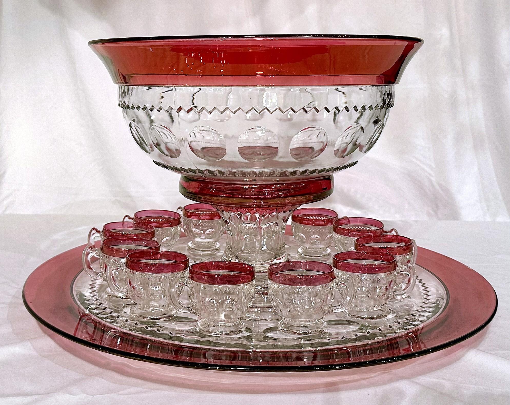 Impressive Antique American Tiffin Cranberry Glass 14 Piece Punch Bowl Service, Circa 1940. 
A renowned and heavily collected glass firm, Tiffin Glass (of Tiffin, Ohio) operated from 1880 to 1980.  This complete punch bowl set is a fabulous example