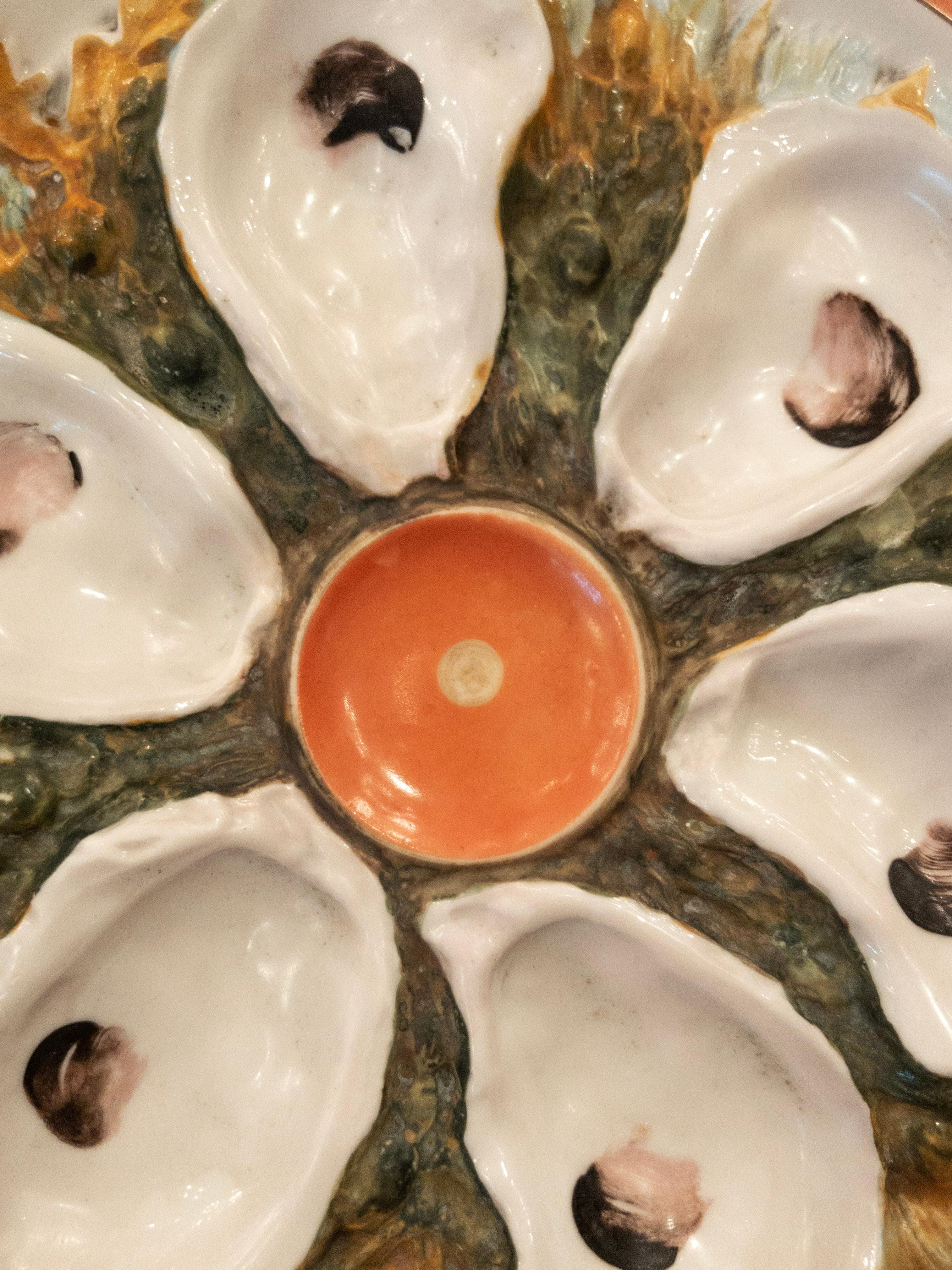 Antique American union porcelain works oyster plate circa 1880 with crabs, coral accent colors, and seaweed.