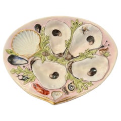 Ancienne assiette à huîtres américaine «UPW » en porcelaine rose et verte représentant des animaux de la mer, vers 1880