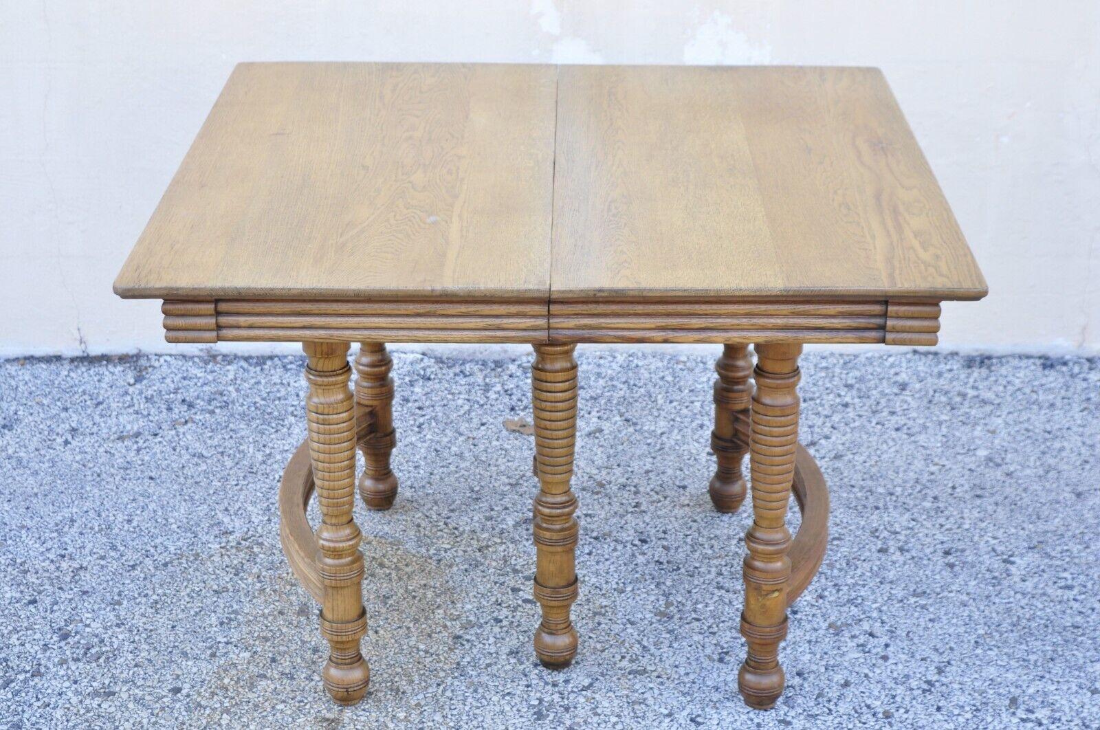 Antique American Victorian oak wood square extension dining table with 3 leaves. Item features (3) 11