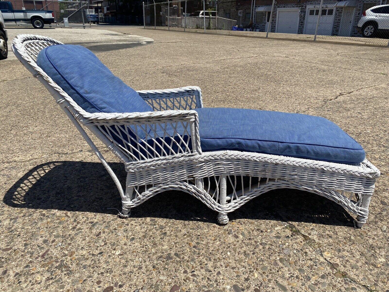 Antique American Victorianwhite wicker sunroom chaise lounge arm chair sofa. Item features wicker wrapped wooden frame, blue cushions, very nice antique item, great style and form. Circa early to Mid 20th Century. Measurements: 34.5