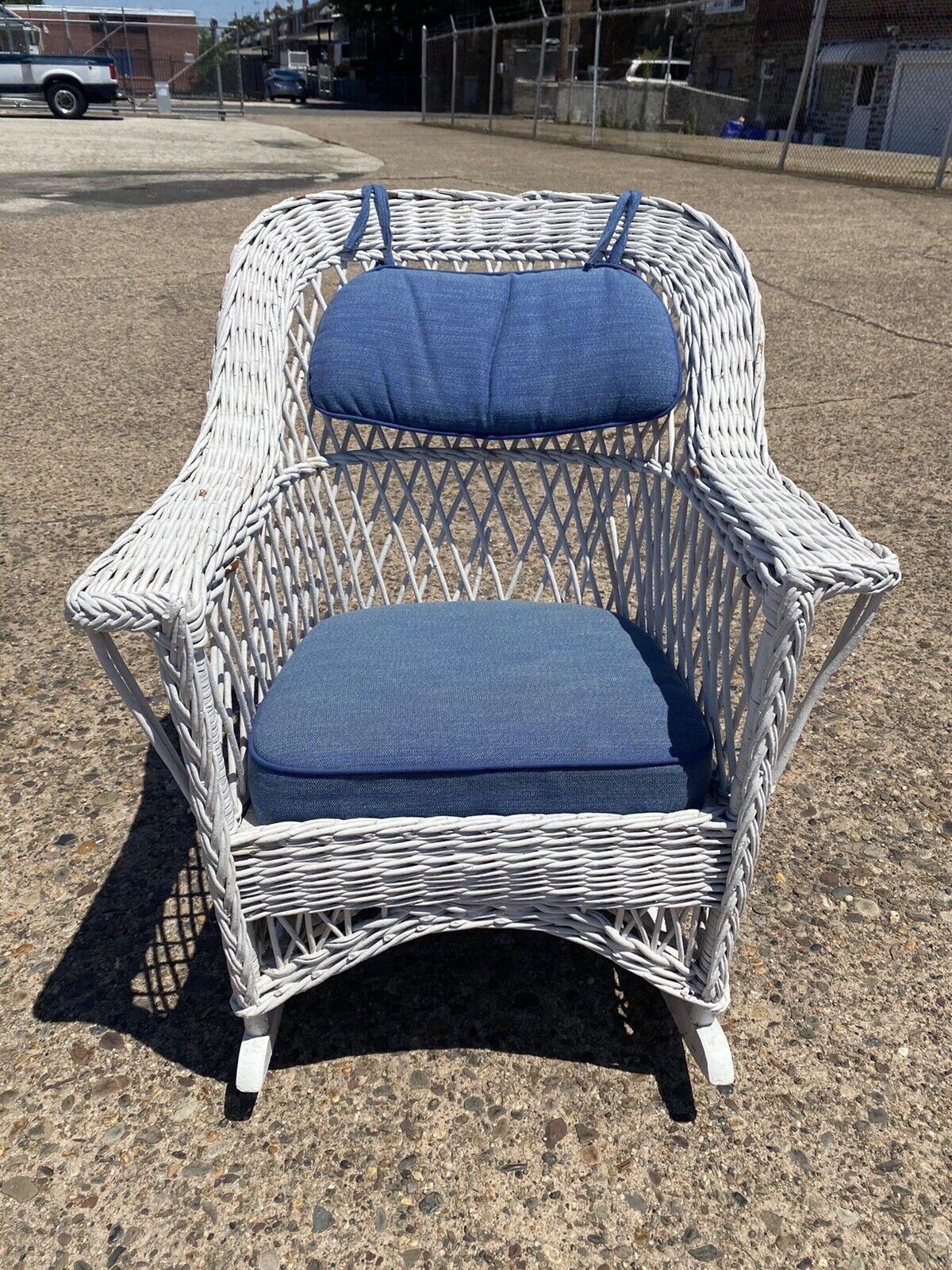 Antique American Victorian White Wicker sunroom rocking chair rocker. Item features wicker wrapped wooden frame, blue cushions, very nice antique item, great style and form. Circa early to Mid 20th Century. Measurements: 35