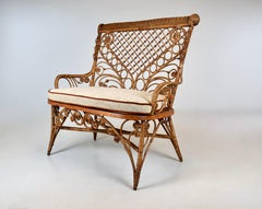 Antique American Victorian Wicker And Caned Settee or Courting Bench