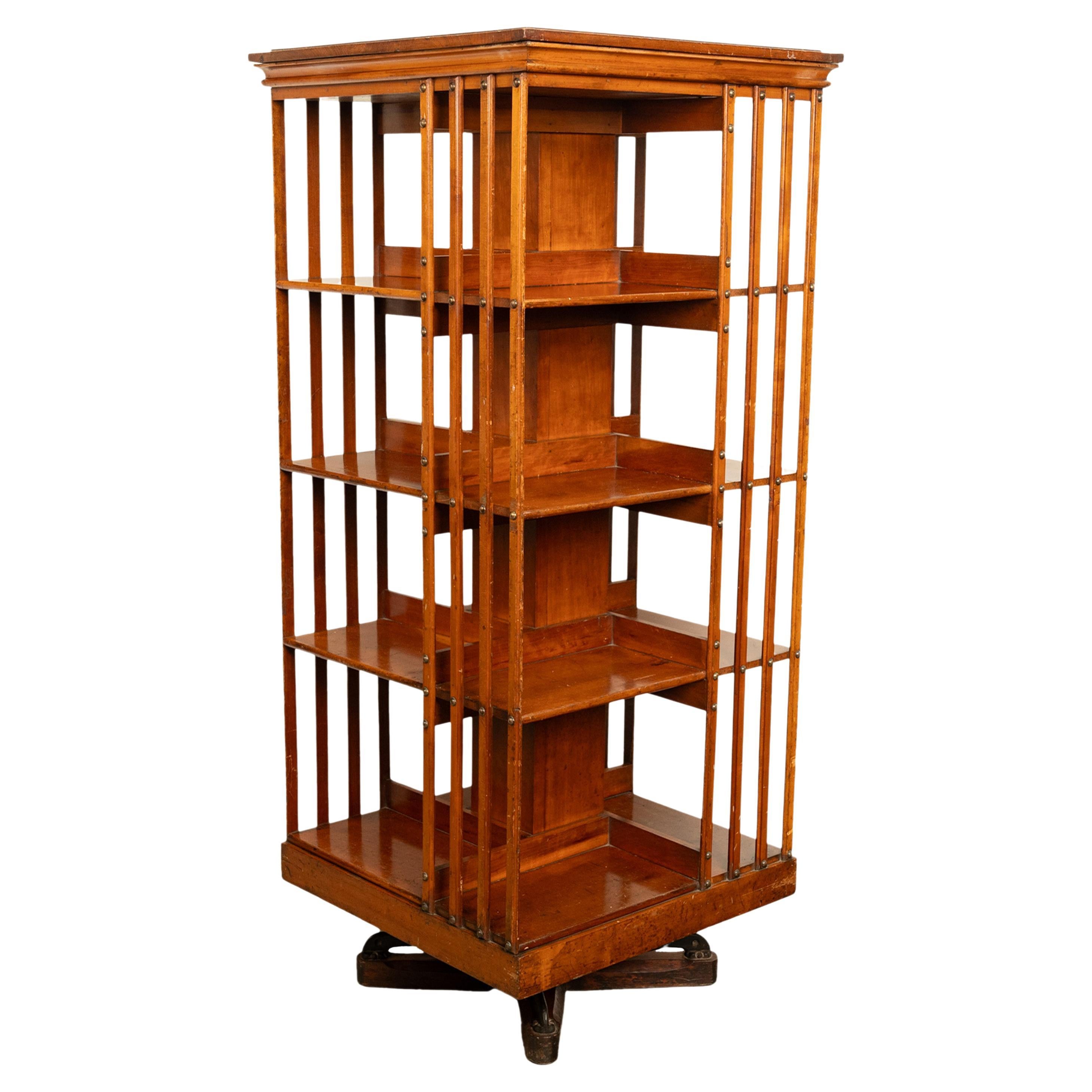 A good antique American walnut four tier revolving bookcase, by John Danner Co, Canton Ohio, 1877.
The four tier bookcase having tots of book storage on four sides, the bottom tier for oversize books, the bookcase turns on a quadraped revolving