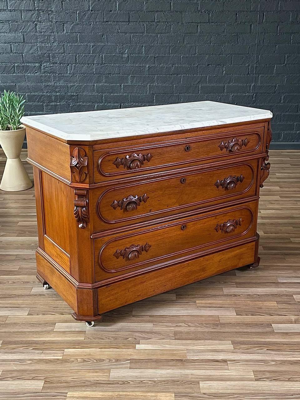 Materials: Walnut, Original Marble, Casters
Style: Antique American 