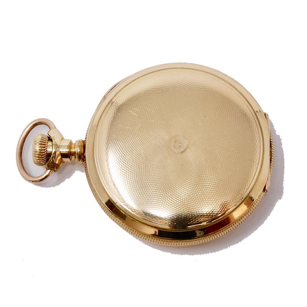 Antique American Waltham Hunter Pocket Watch, 15-jewel movement, serial number 5703127, size 6s, grade K. The white porcelain dual dial has painted black Arabic numbers and subsidiary second hand dial. The watch has a gold-filled case with an