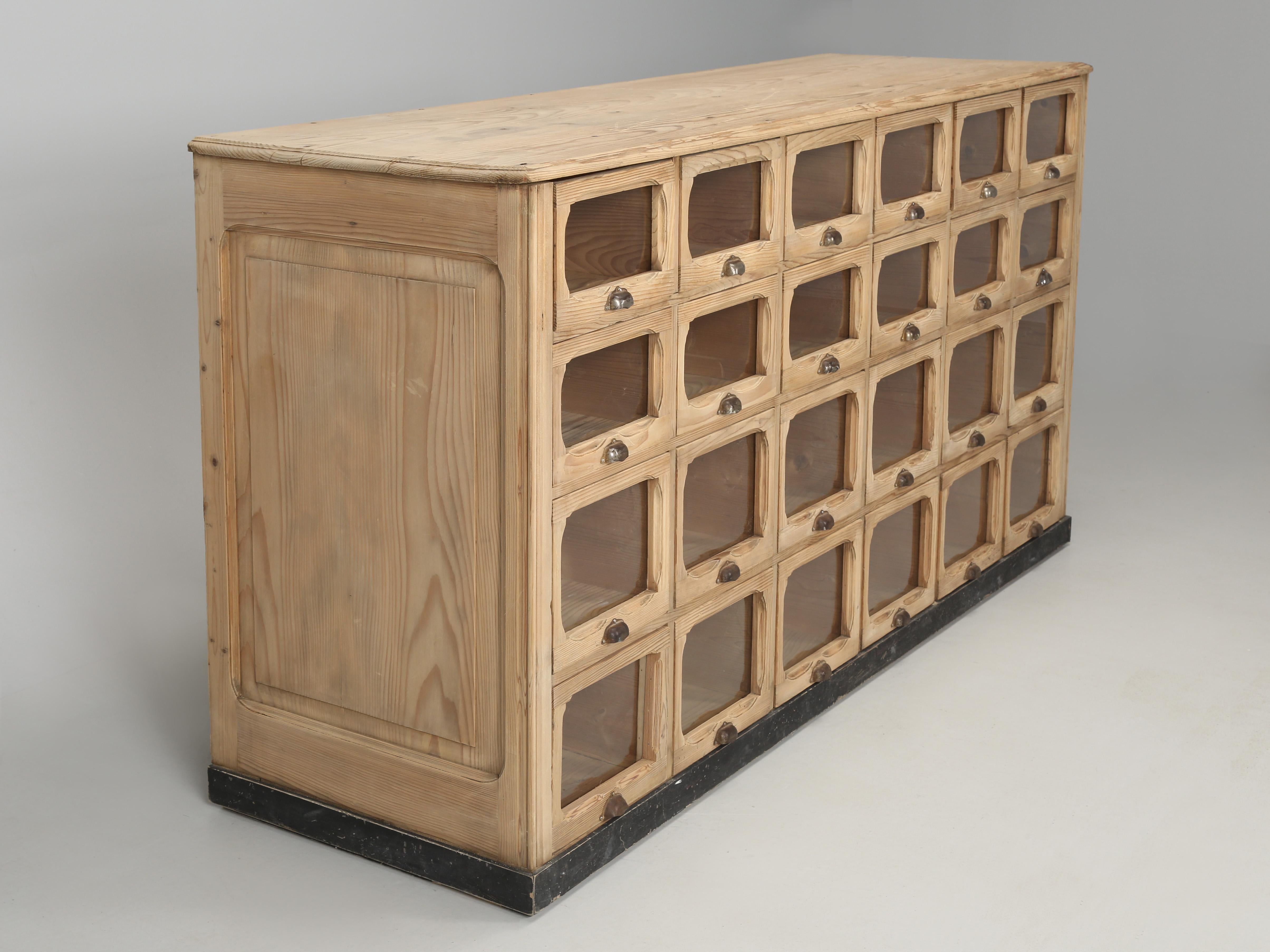 Antique American pine apothecary cabinet, or as the English would call it, a shop fitting. There are others who might describe it as a seed cabinet, regardless, to find a large multi-drawer cabinet not beat up from a commercial application and still