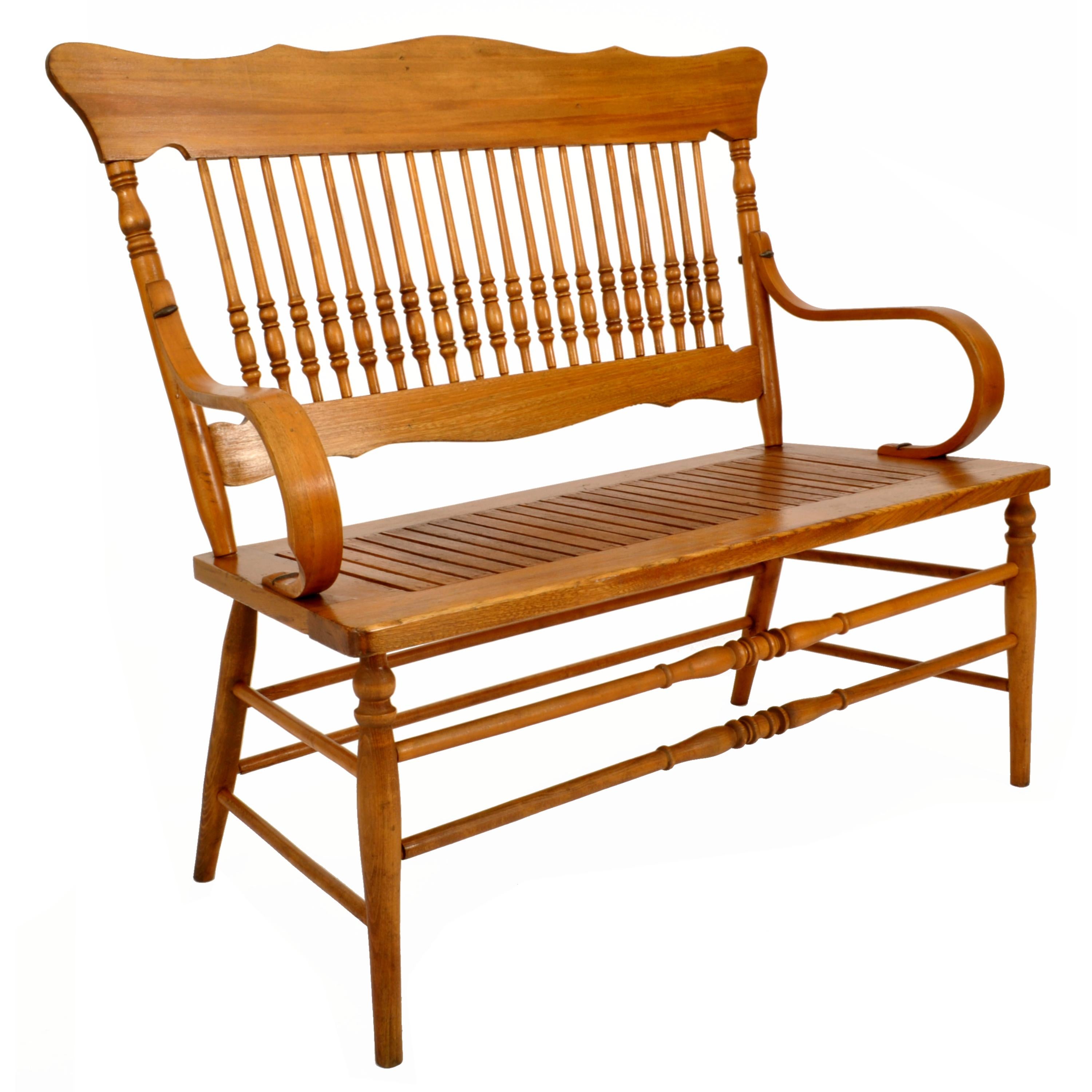A very good antique American Colonial New England spindled & bentwood deacon's bench, circa 1880.
The bench of unusual diminutive size (will comfortably seat at least two adults) and having a shaped crest back with turned spindles below, a pair of
