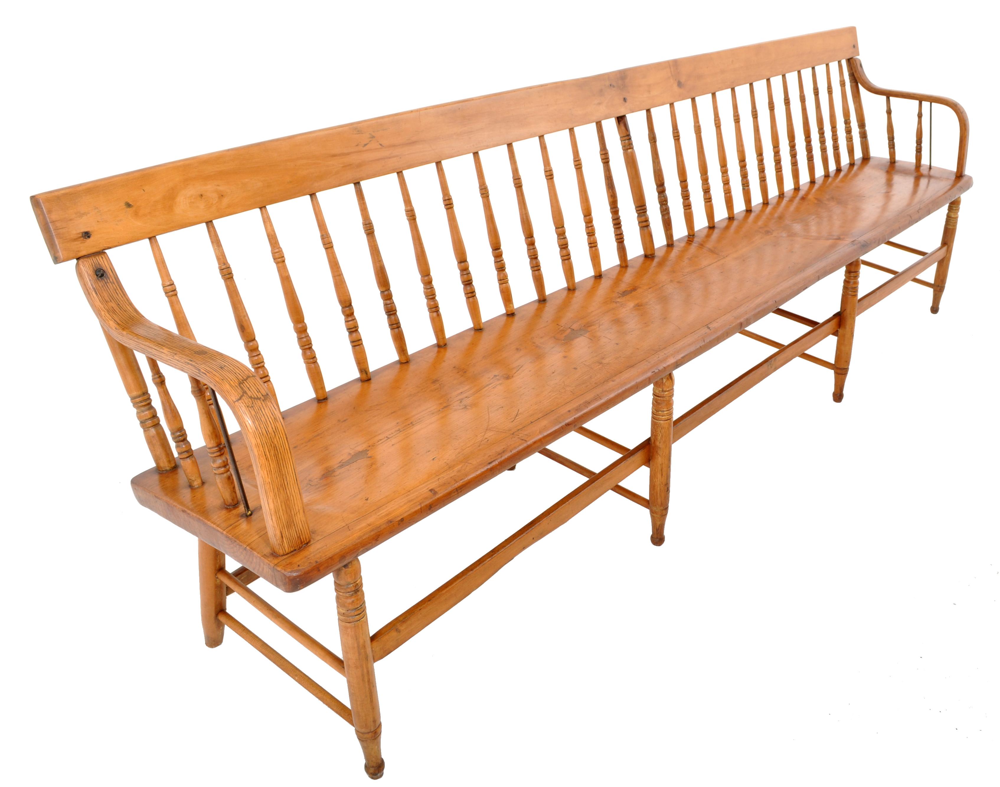A good long (8ft) antique American pine and maple Colonial style long spindled back deacon's bench, circa 1880. The bench having a single back splat with turned spindles below and having 'bentwood' arm supports at each end. The bench having a long