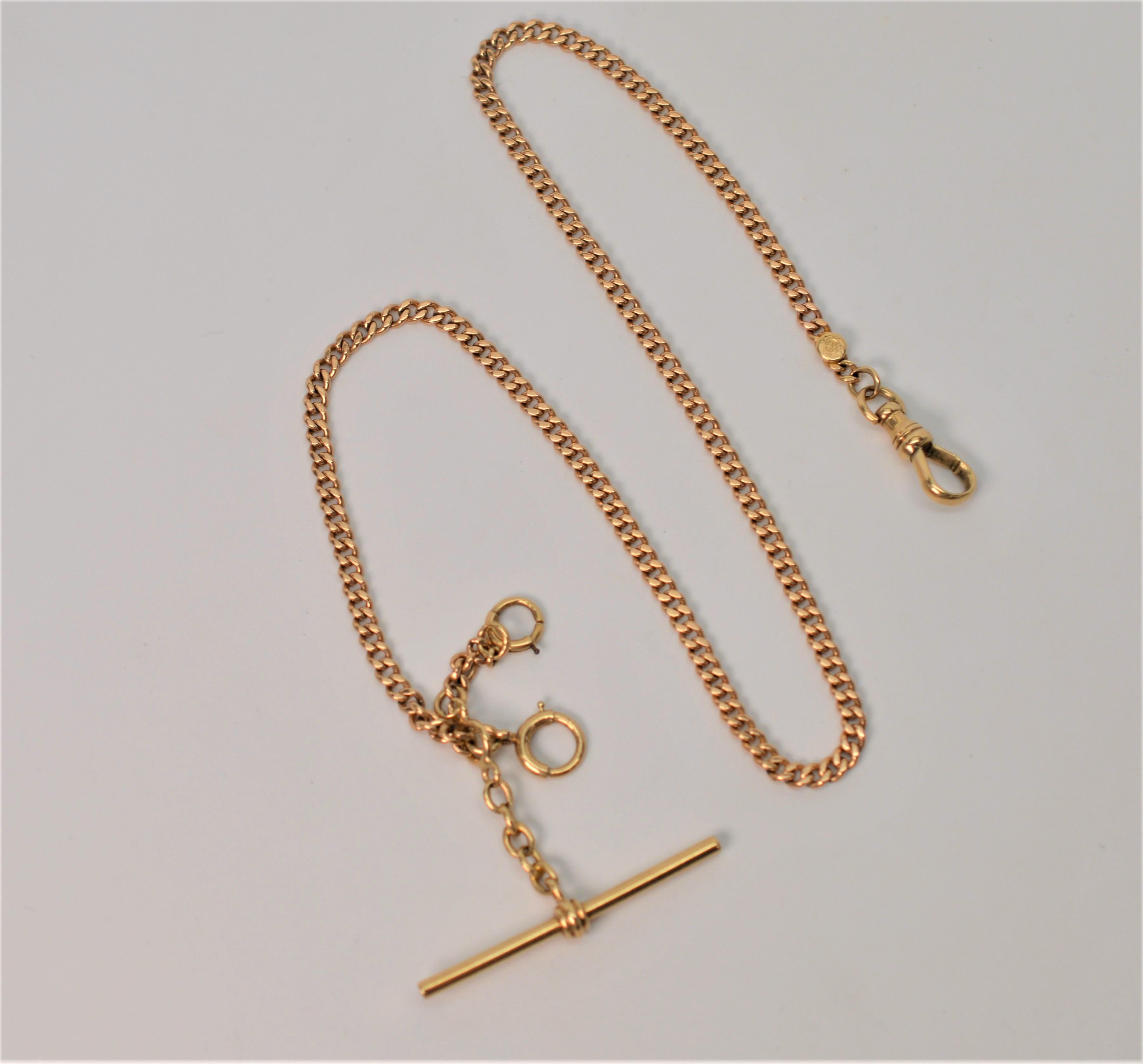 Antique American 14 Karat Yellow Gold Pocket Watch Chain. Three millimeter gauge chain with T-bar, non-swivel clip and two jump chains.
 Fourteen inches in length. In gift box.