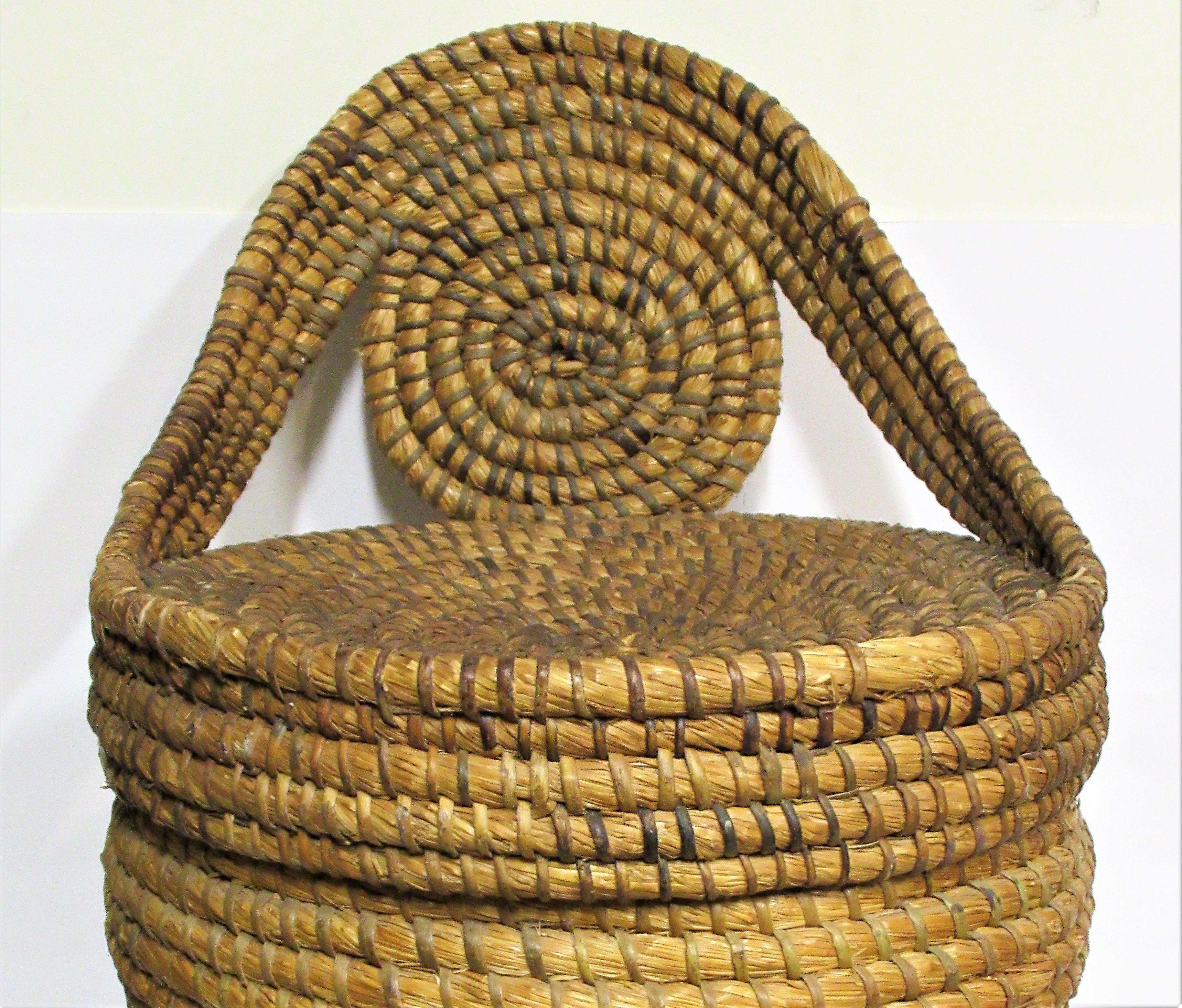 Large antique American Folk Art woven rye straw lidded basket with a very unusual - possibly rare form. Pennsylvania, late 19th-early 20th century. Measures 24 inches high x 16 inches wide across front x 18 inches across at top lid across from back