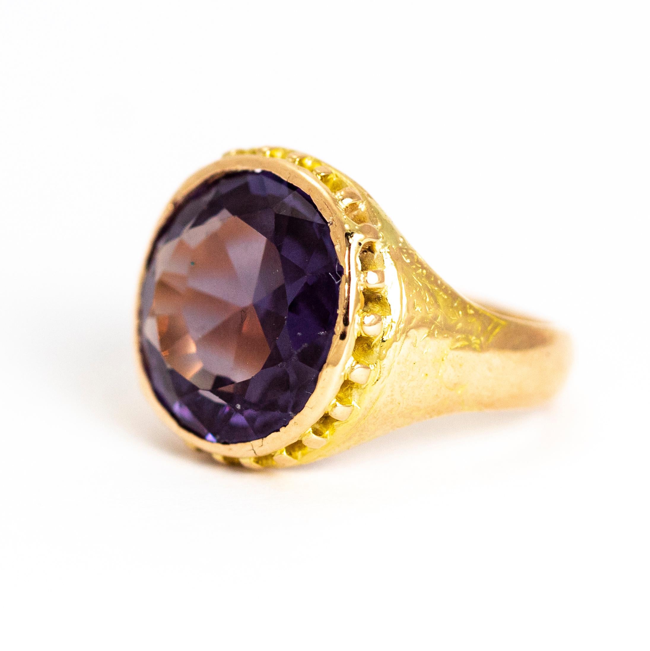The Amethyst set in this ring has a wonderful sparkle to it and in the light shows beautiful hues of purple. The Amethyst is round in shape and cut to really show off the colour. The chunky and ornate shank is modelled in 15 carat gold.

Ring Size: