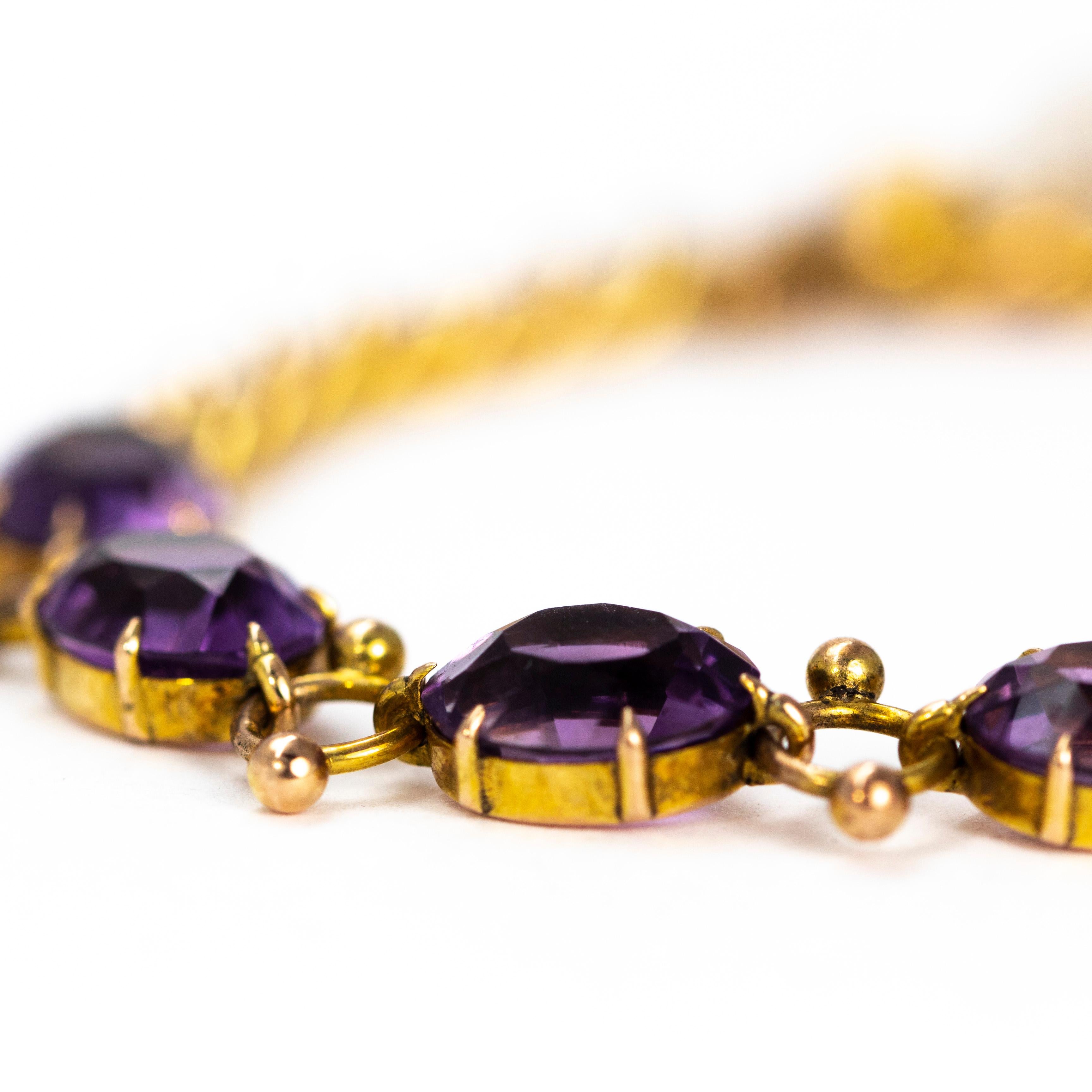The stones in this bracelet are a gorgeously rich purple colour. They are set in simple claw settings and are connected with orb detailed links. The other half of this bracelet is made up classic curb links. 

Length: 7inches
Stone Dimensions: 7x