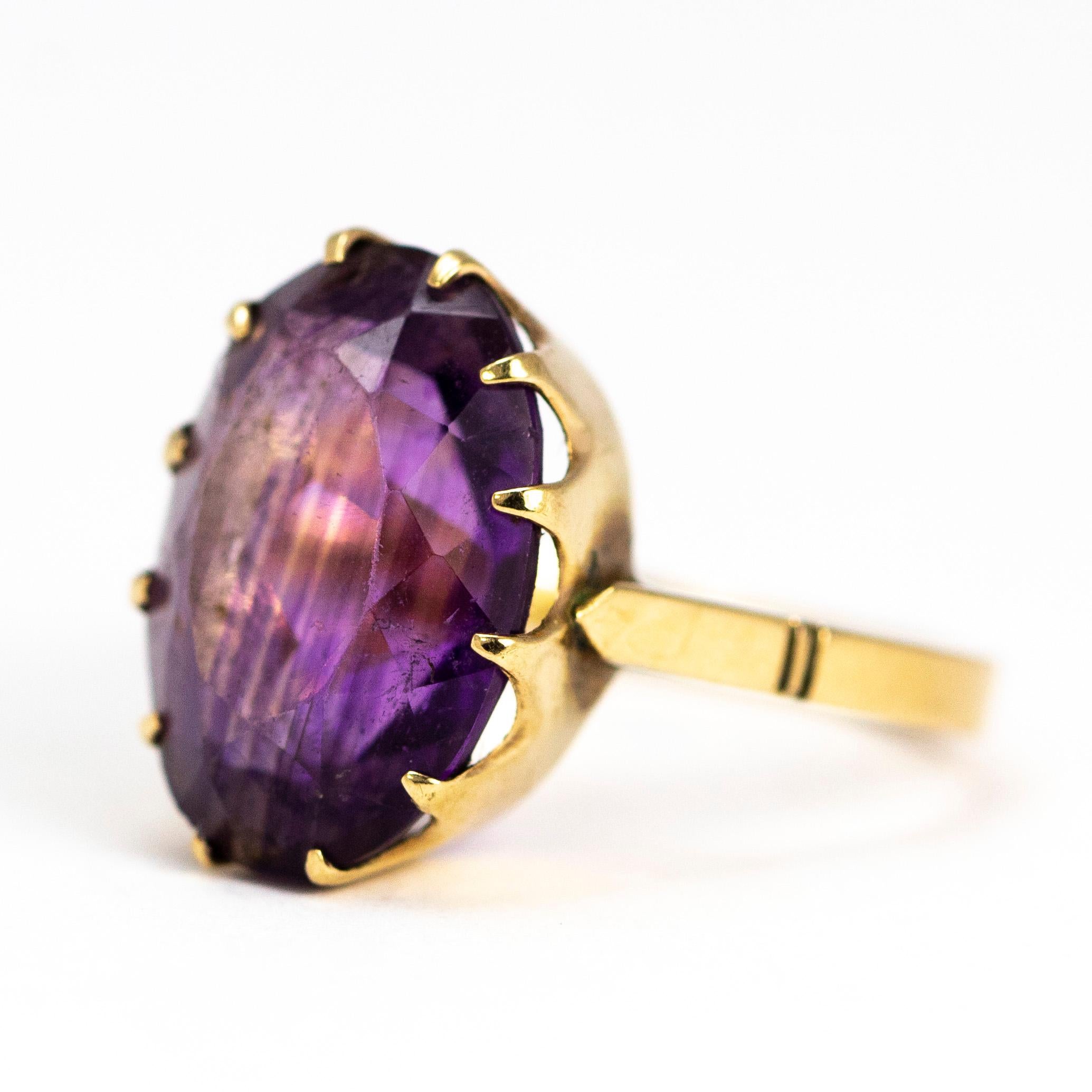 The striking purple of the amethyst in this simple cocktail ring is stunning. The stone is set in simple claws which hold al around the stone. 

Ring Size: J 1/2 or 5 
Stone Dimensions: 14 x 10mm 

Weight: 2.7g
