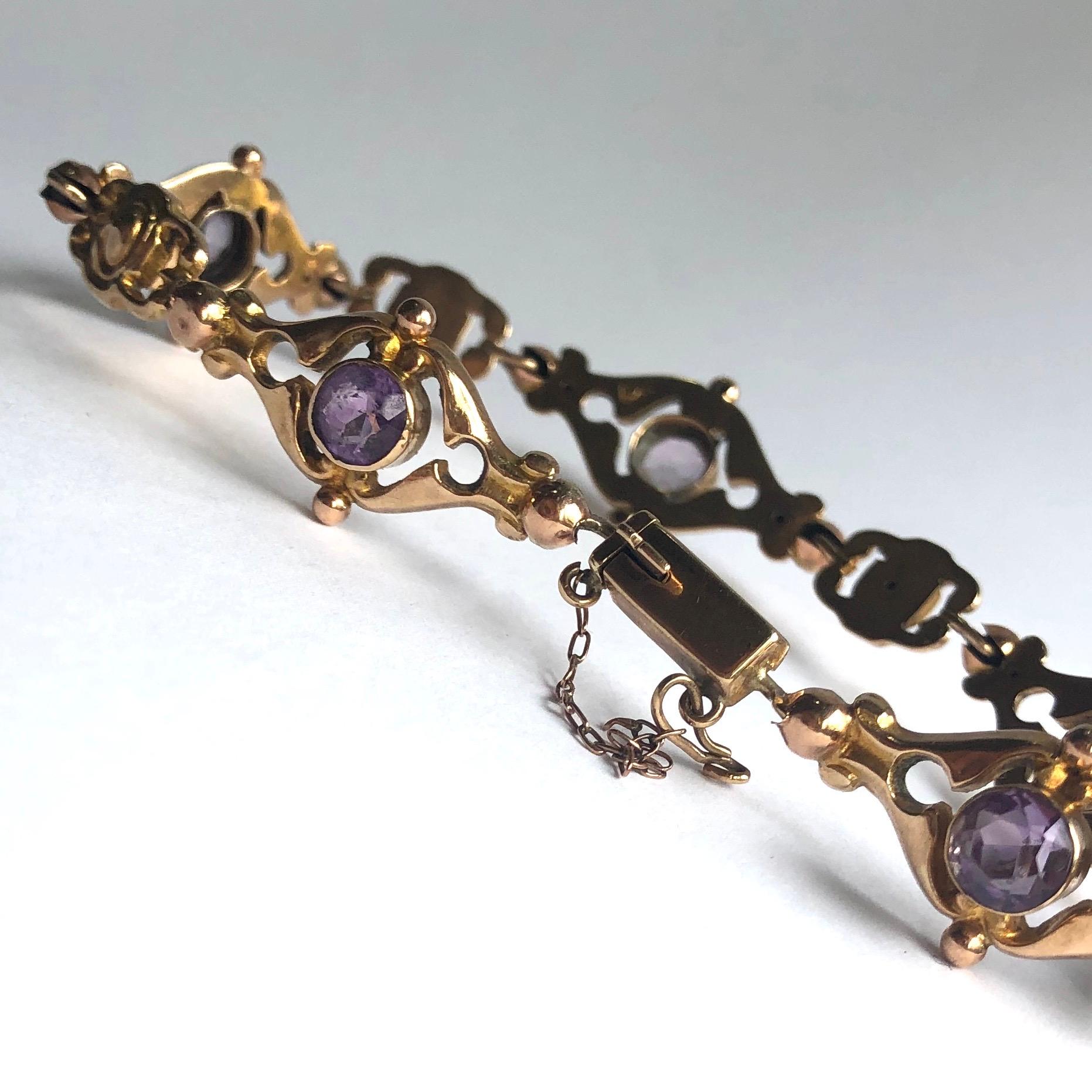 The links in this bracelet are decorative and beautiful. Five of the links hold an amethyst measuring 75pts and are modelled in 9ct gold. 

Length: 20cm
Bracelet Width: 14mm 

Weight: 9.4g