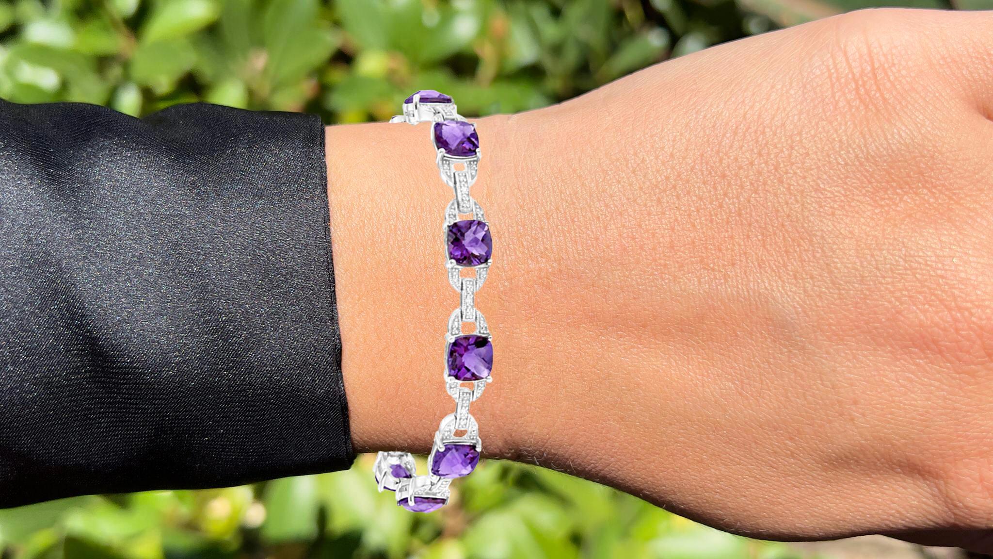 It comes with the Gemological Appraisal by GIA GG/AJP
All Gemstones are Natural
10 Amethysts = 15.00 Carats
10 Diamonds = 0.05 Carats
Metal: Sterling Silver
Length: 7 Inches
Width: 0.28 Inches