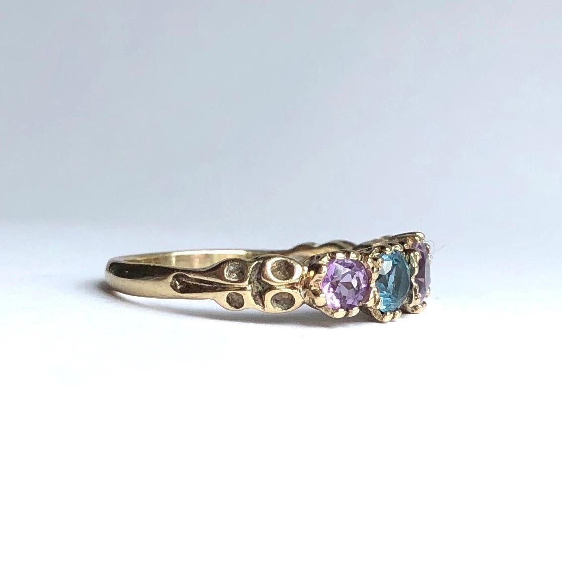 The stones in this ring are absolutely stunning, they are the most wonderful shades of blue and lilac. The setting in which they are set in is ornate and the shoulders are equally as detailed and modelled in 9ct gold. 

Ring Size: O or 7 1/4 
Band