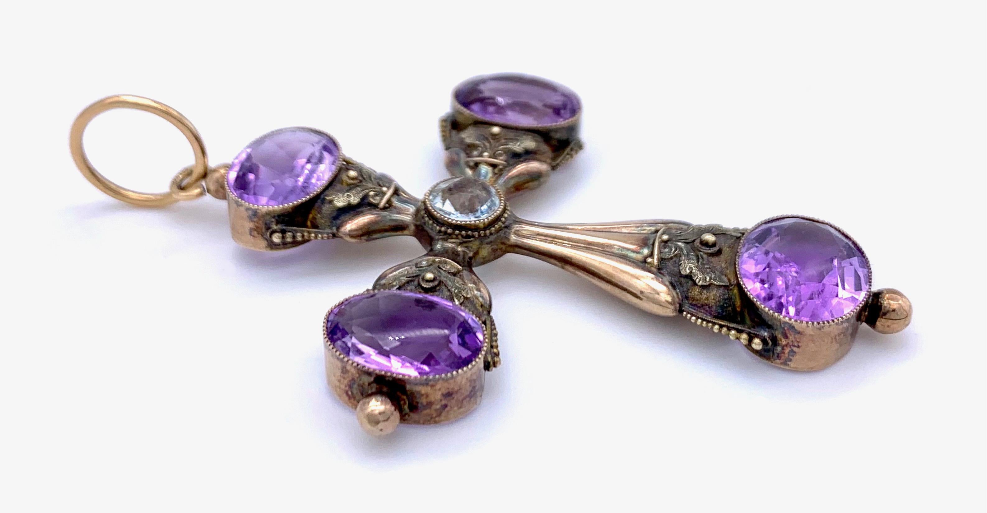 Wonderful large Biedermeier cross with intensive purple oval facetted amethysts and a round cut central aquamarine.