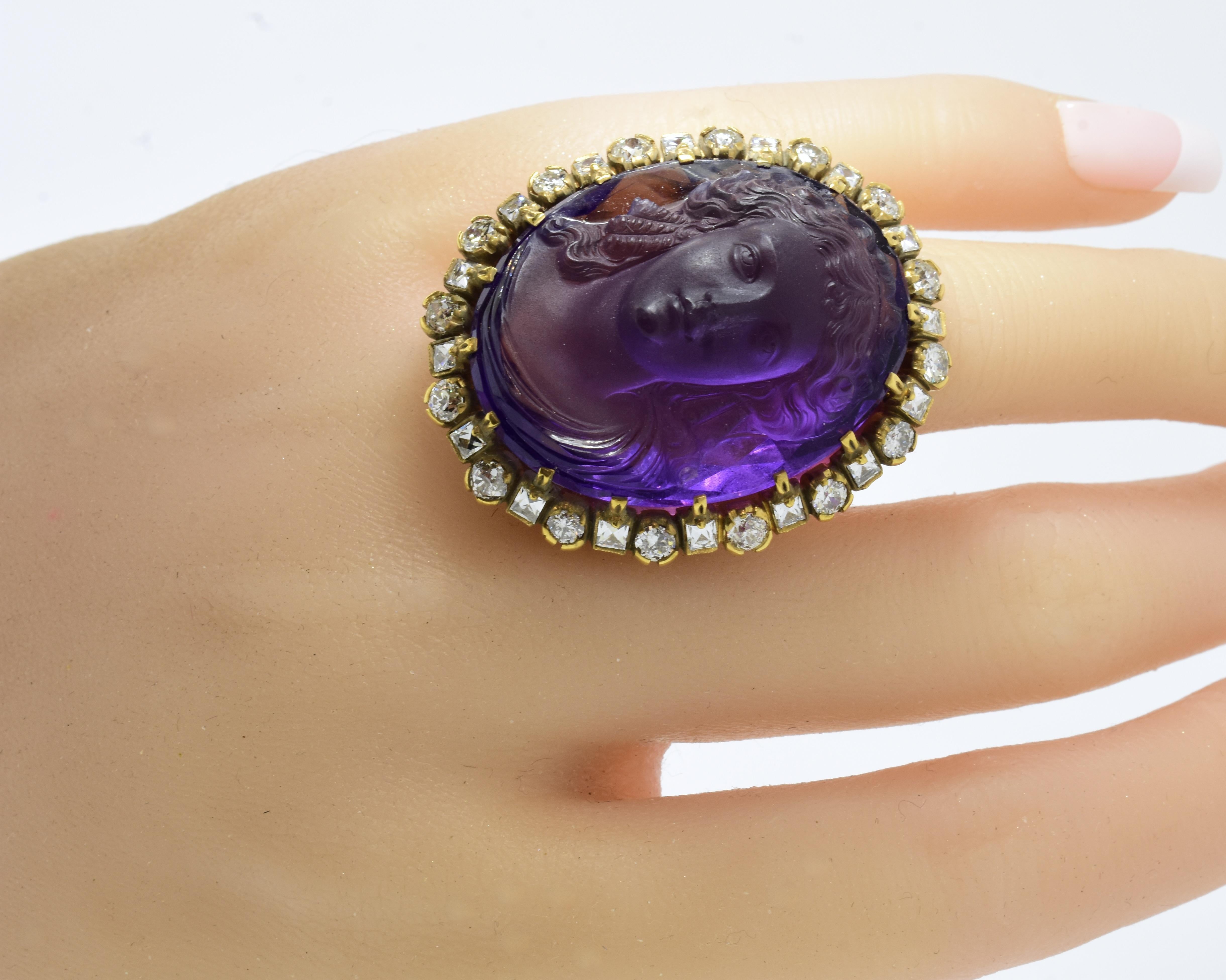 Antique cameo and diamond ring, circa 1880.  Large, bold and unusual,  the natural amethyst, held by 16 prongs, weighs approximately 65 cts., and displays a fine bright purple color.  The carving of a classic early Greek or Roman woman with