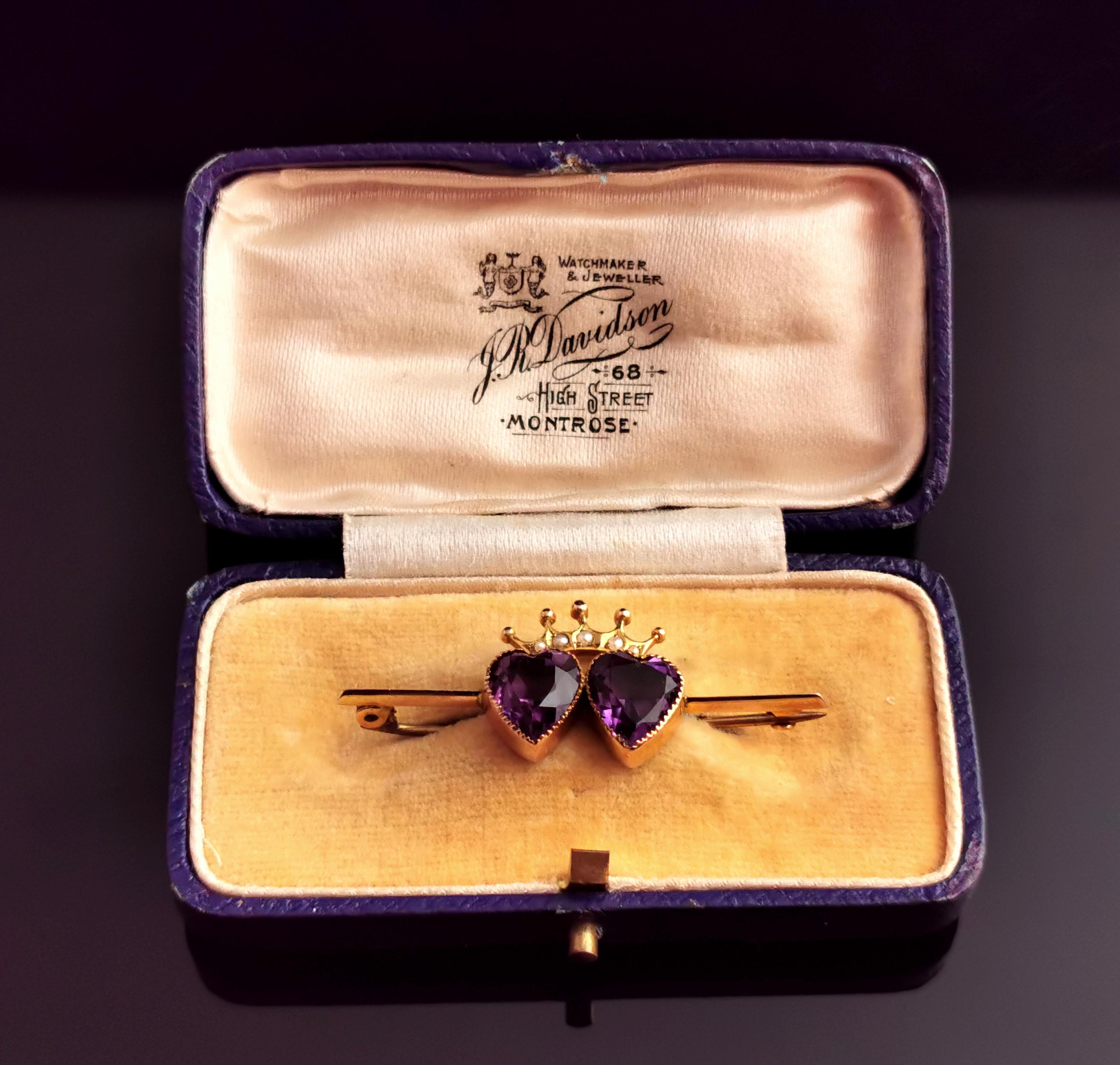 A stunning antique Amethyst and seed pearl crowned hearts brooch in 9kt gold.

The crowned hearts were a strong and powerful symbol of love between two people and fidelity or their passion and devotion for each other reigning their love.

This