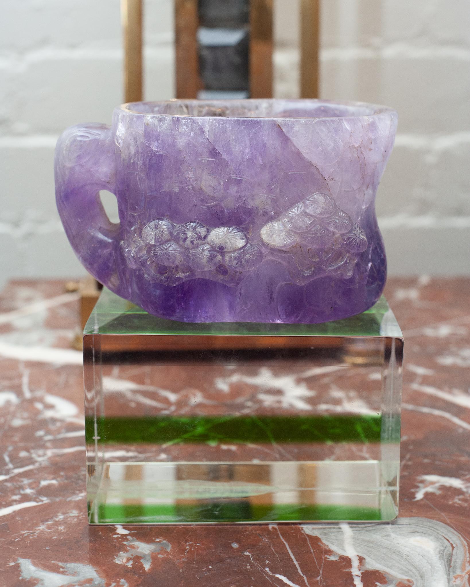 A stunning and unusual antique amethyst carved mug / cup sculpture, with carved mushroom motifs on each side and a detailed handle. This antique carving is made from a solid block of amethyst, and was entirely carved by hand by a master artisan. A