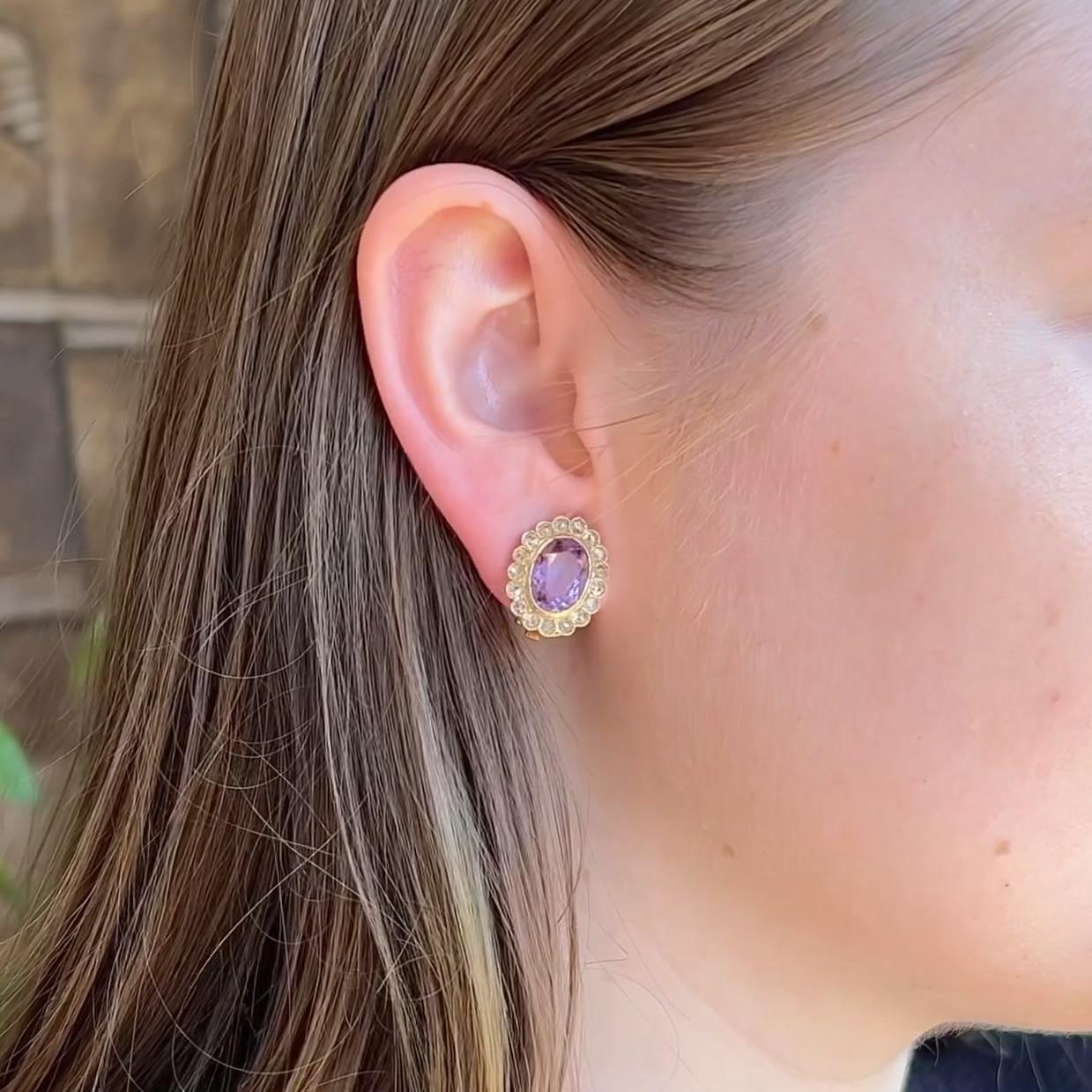 One Pair of Antique Amethyst Diamond 18 Karat Yellow Gold Clip On Earrings. Featuring two oval brilliant cut amethysts with a total weight of approximately 4.85 carats. Accented by 34 rose cut diamonds with a total weight of approximately 1.35