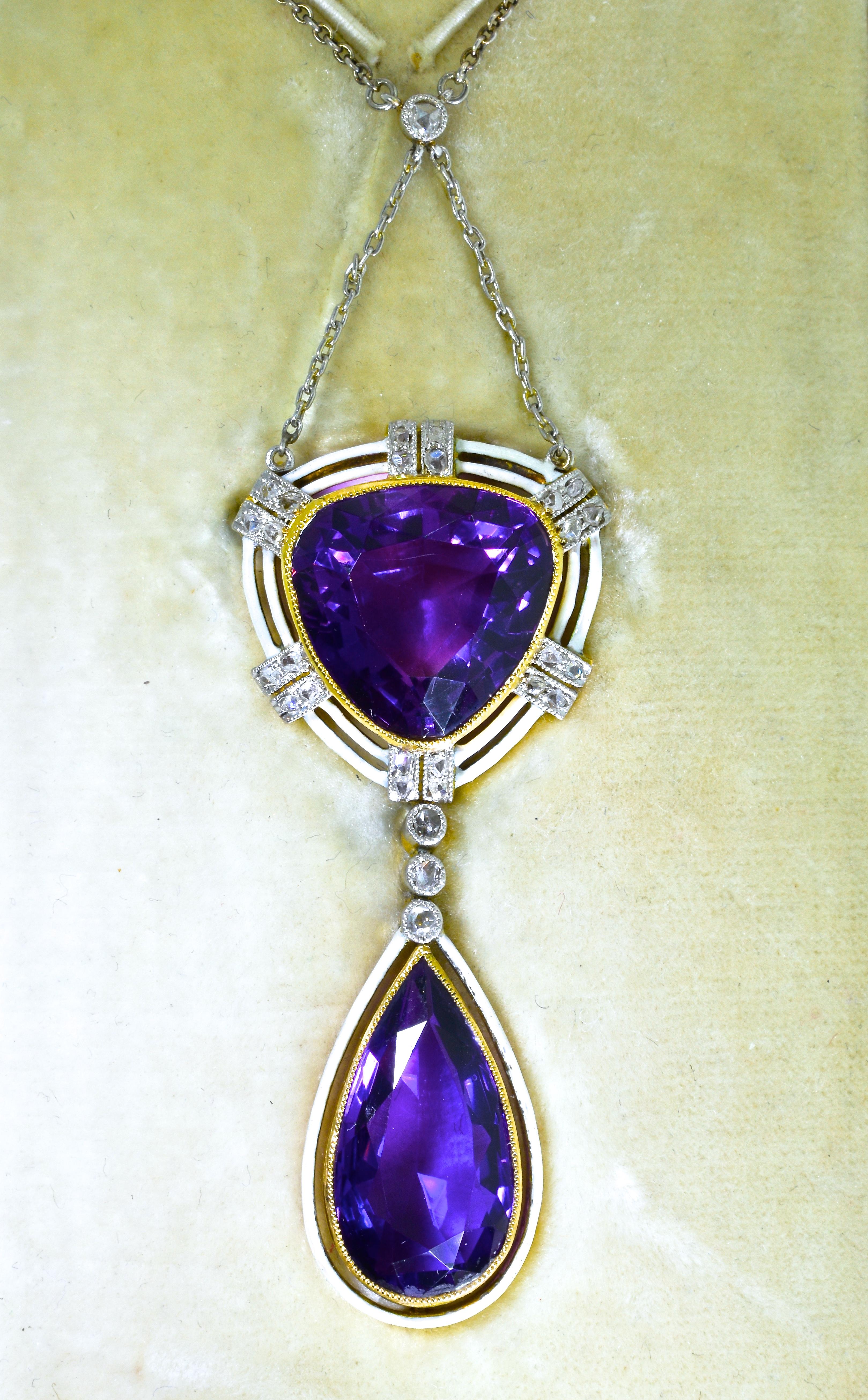 Antique Belle Epoque 18K gold, white enamel and very fine deep natural amethyst pendant suspended from a platinum chain.  The pendant  is 2 inches long and the chain can be worn either at a long 20 inches or use the shortener and wear it at 16.5