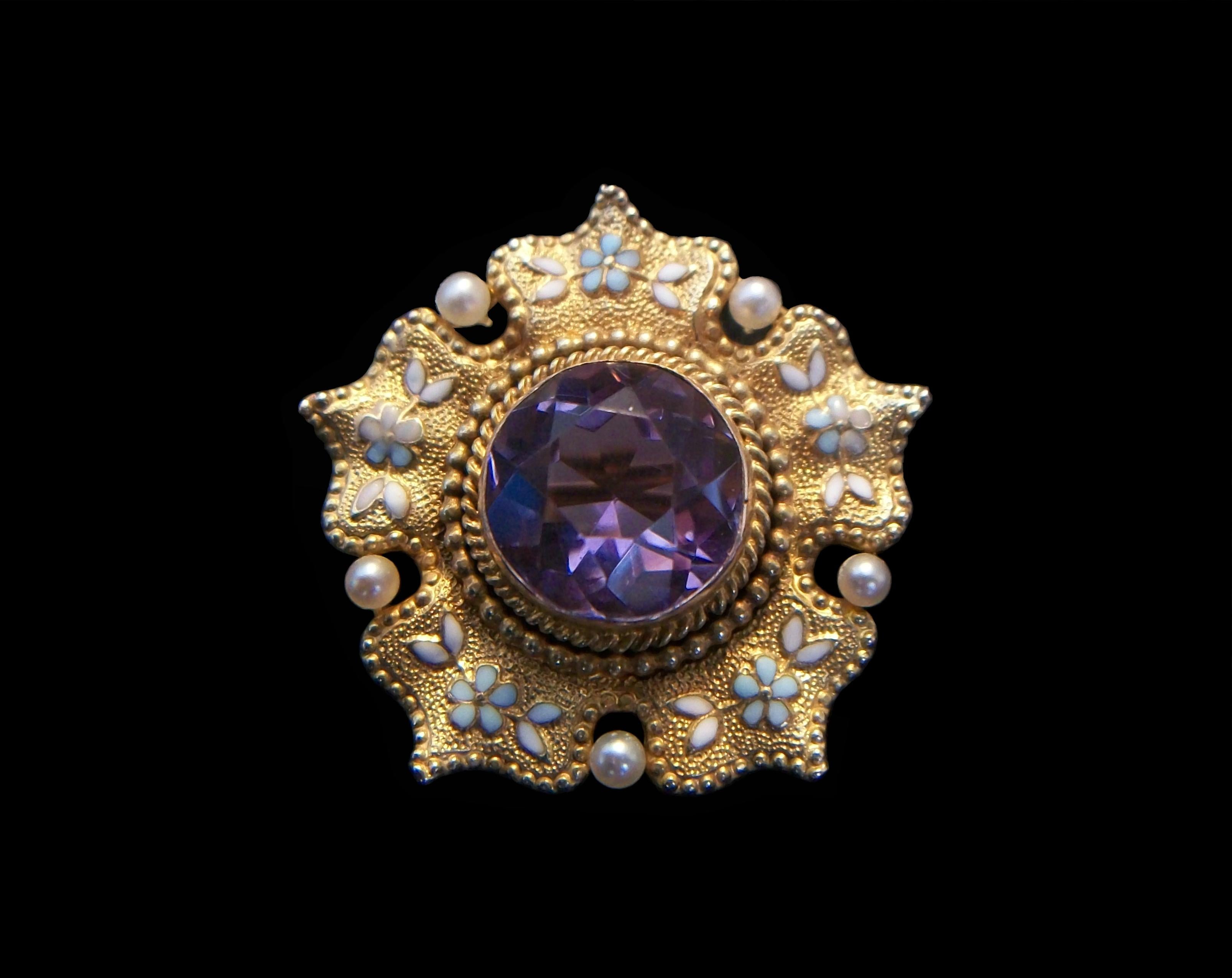 Fine antique amethyst, seed pearl and 14K yellow gold pendant or brooch with blue and white 'forget-me-knot' enamel flowers and leaves - featuring a round bezel set amethyst to the center (approx. 2.71 total carat weight - 10 mm. diameter x 6 mm.