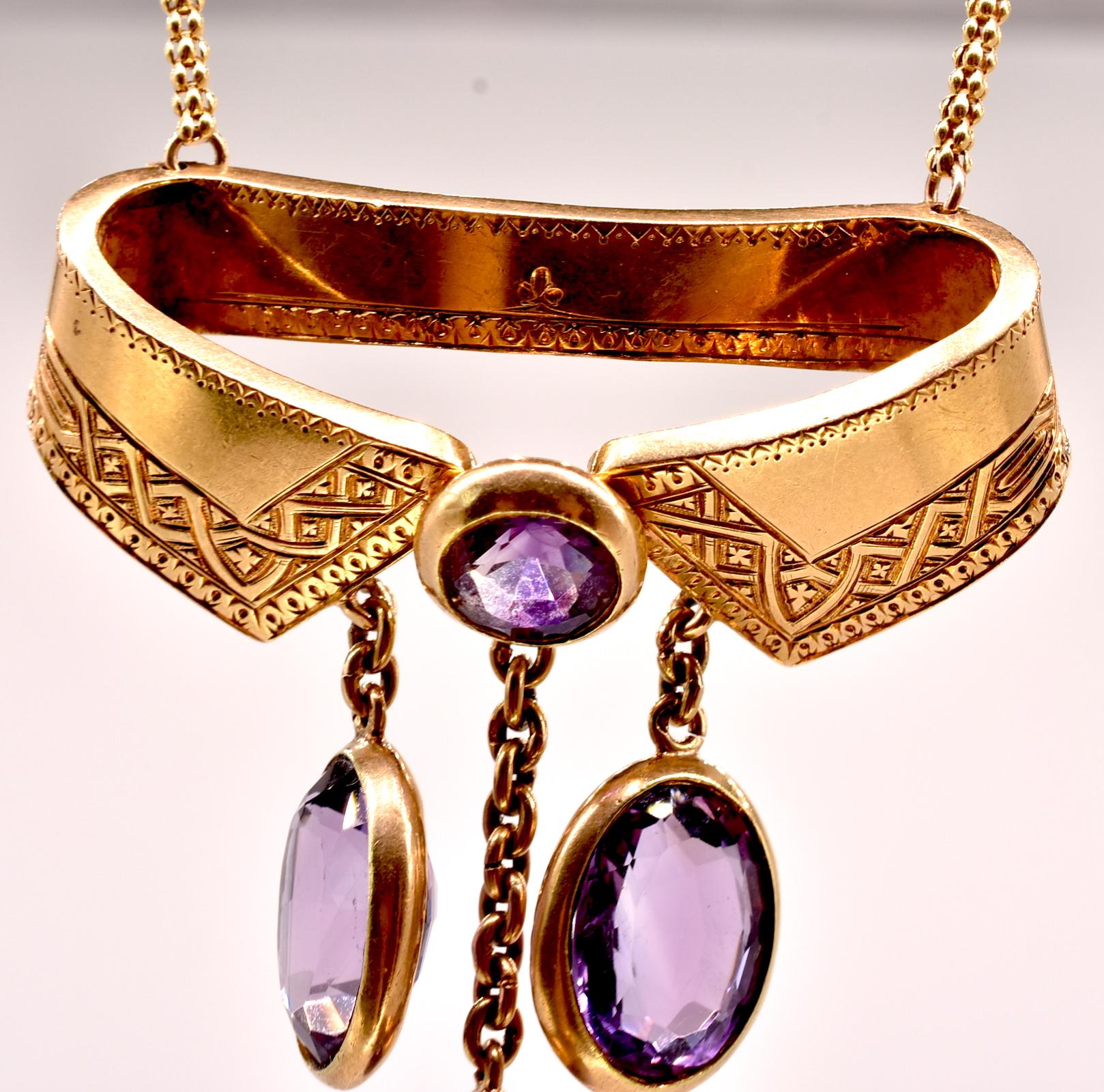 18K French gold collar necklace with 3 amethyst pendants hanging from a gold chain and 1 amethyst at the center of a replica of a gold 