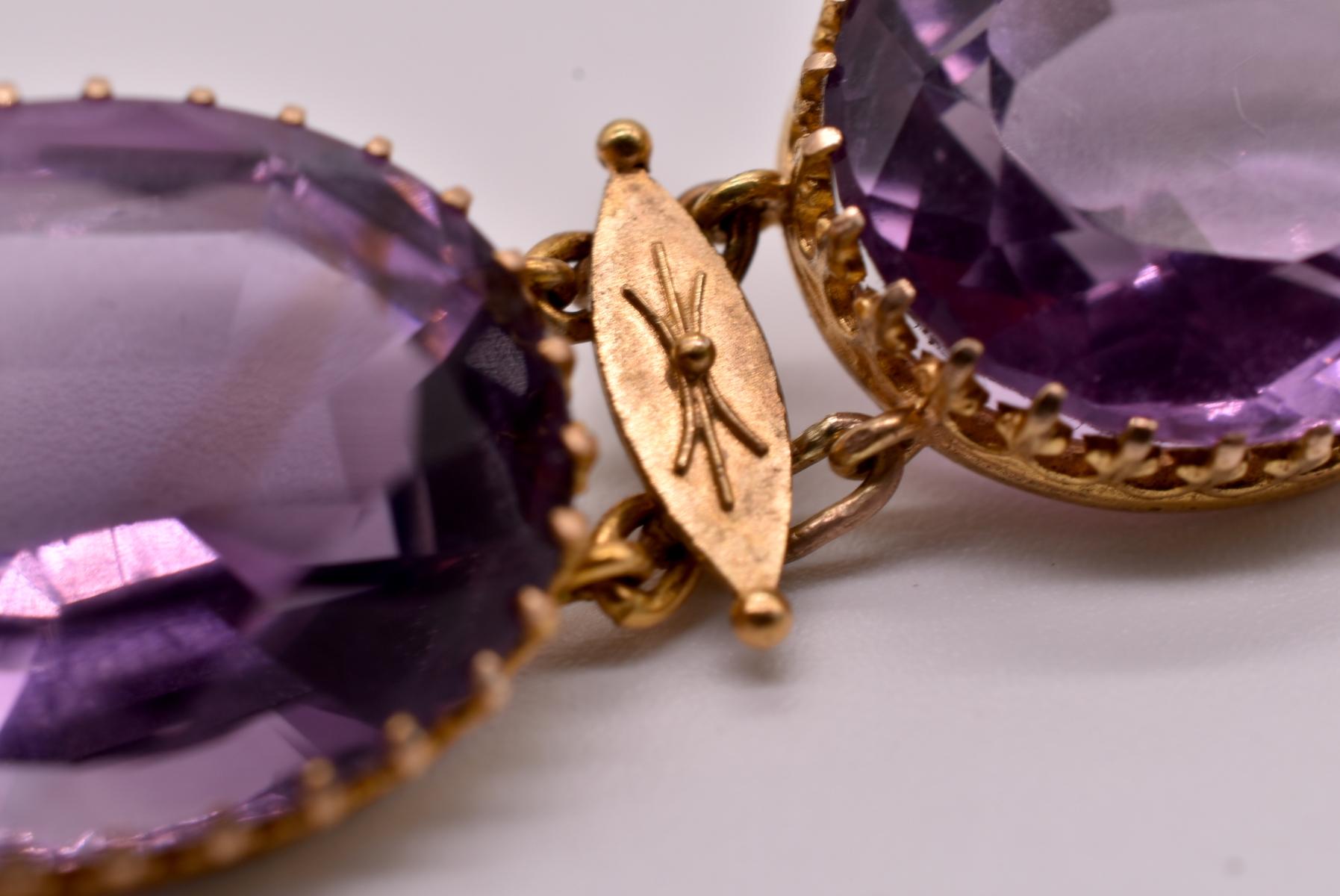 French style amethyst necklace designed in the archeological taste, set with lovely individual claw set links in 18k yellow gold with gold spacers.  An extra amethyst gem link is available to lengthen the chain should this be desired. There is a