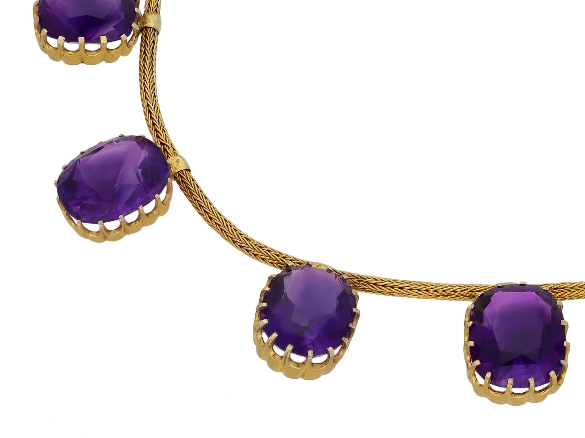Antique amethyst necklace. A yellow gold necklace, set with eleven cushion shape double brilliant cut natural amethyst in open back claw settings with an approximate combined weight of 75.00 carats, with elegant curved fluted claws to an intricate