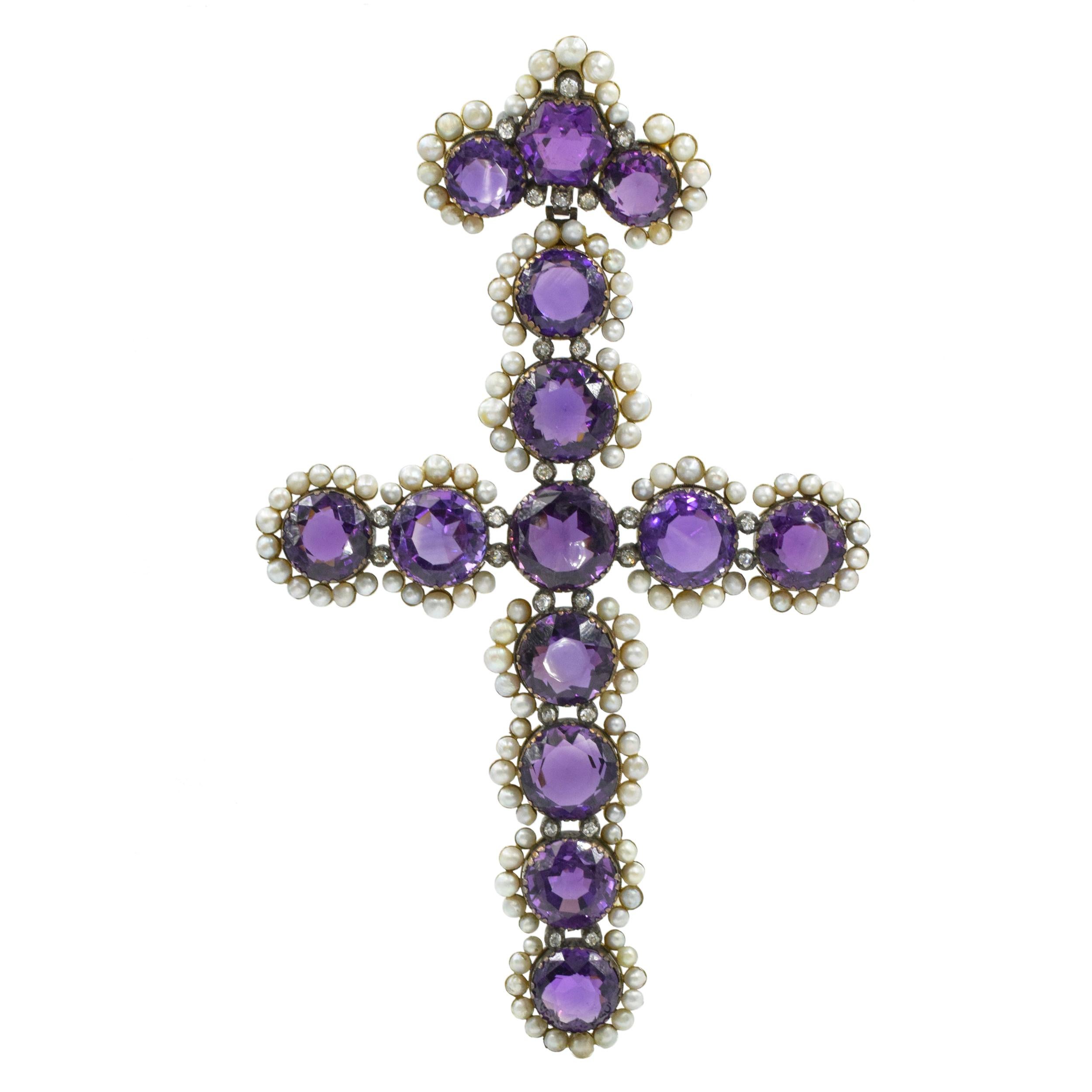 Antique Amethyst, Pearl, and Diamond Cross Pendant. This cross pendant has round amethysts, pearls, and 26 old-cut diamonds weighing approximately 1.75 carats  all set in silver and yellow gold. Circa mid to late 19th century. Dimensions: 19.0 x