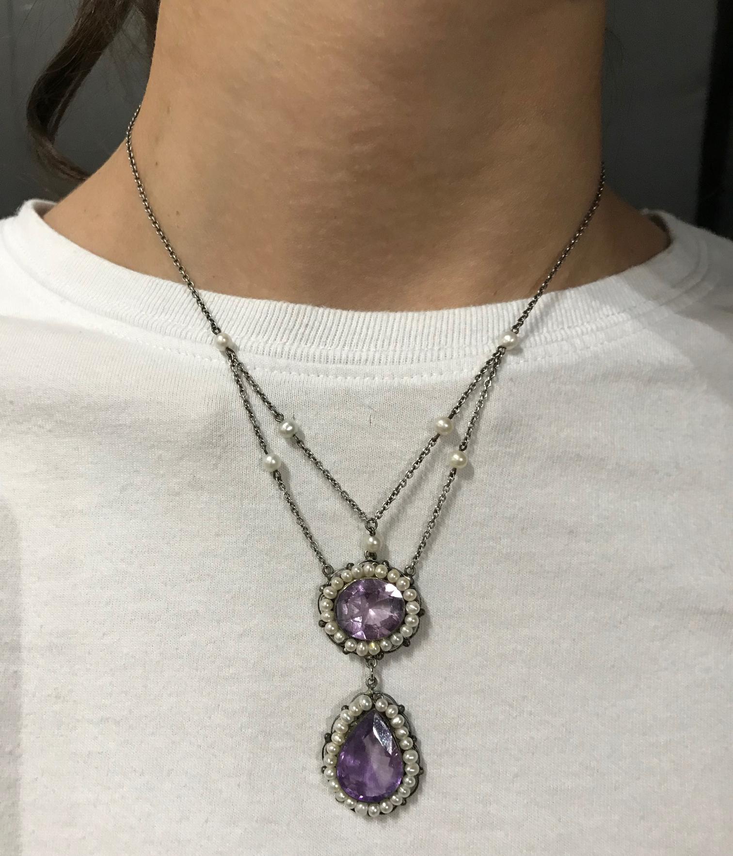 Beautiful Edwardian Amethyst and Pearl ‘Y’ Necklace, featuring Teardrop and Oval faceted purple Amethyst Gemstones,  surrounded by pearls and 2 graduated loops accented with pearls to highlight the collar bone. Hand crafted in Sterling Silver, the