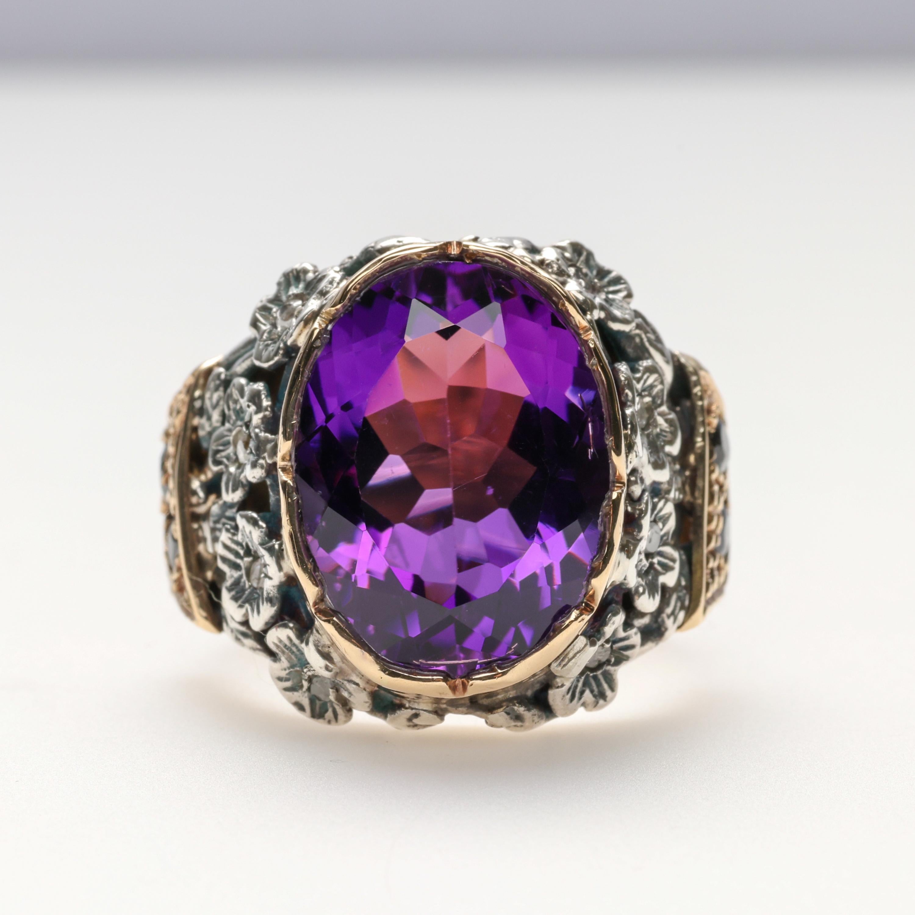 This spectacular original antique Victorian ring features a 17 x 13mm natural amethyst that weighs approximately 9 carats. This pristine gem is set within a notched bezel, surrounded by silver flowers, each set with a central tiny single-cut