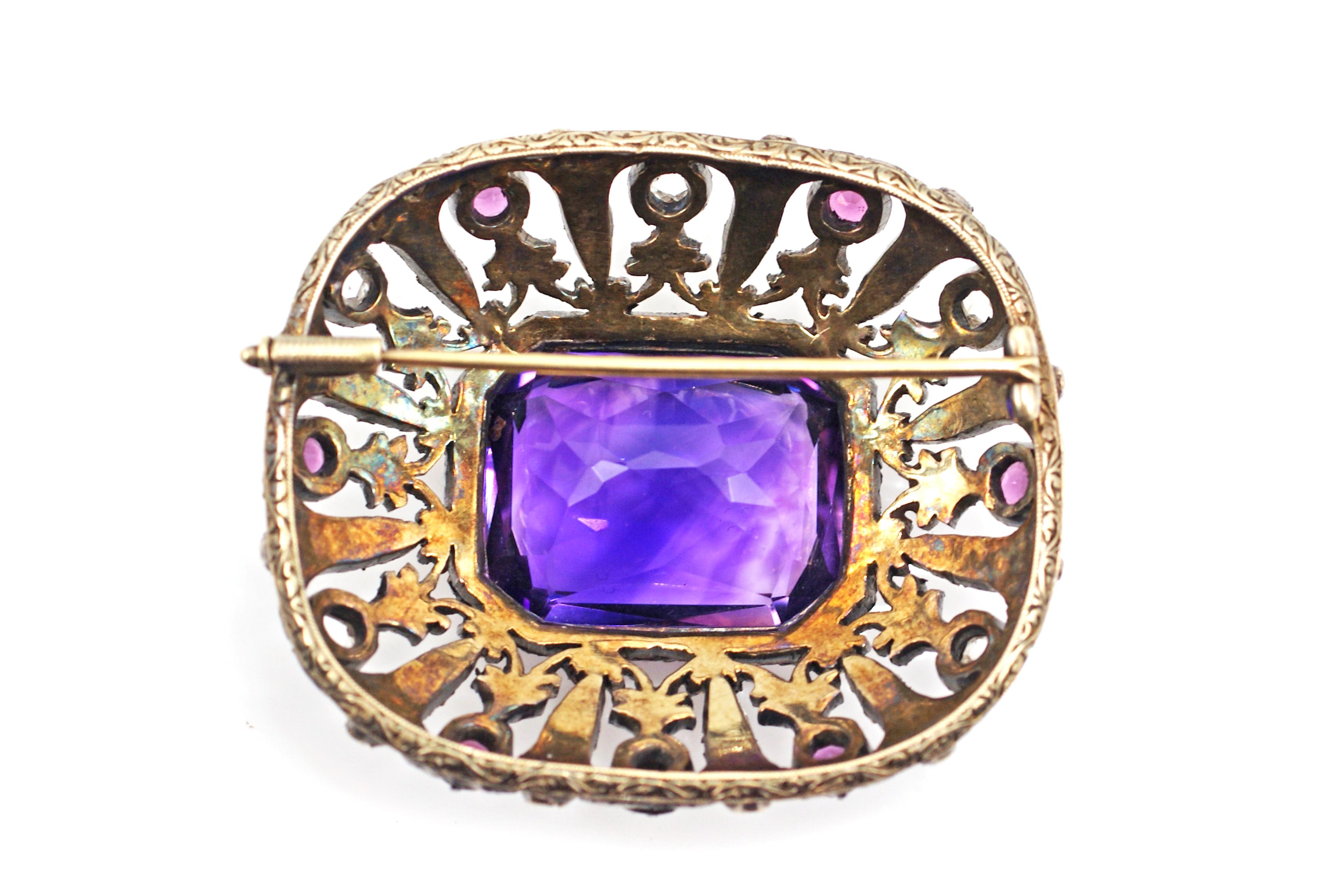 An amazing amethyst measured to weigh approximately 30 carats is the centerpiece of this incredible antique brooch. The faceted, extremely well-cut Amethyst displays a unique color saturation of deep, bright purple with slight shimmers. The Amethyst