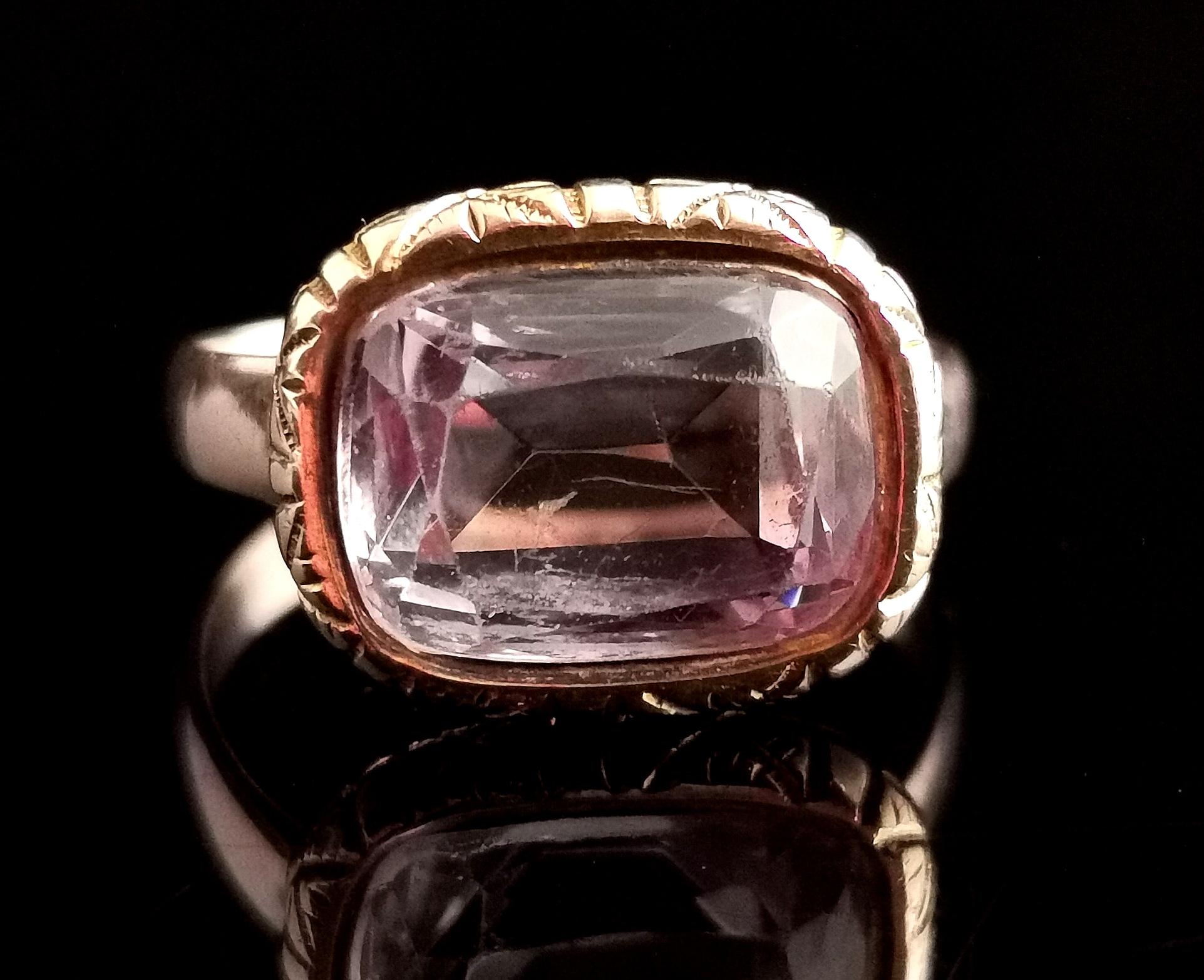 An attractive and unusual antique 9kt gold and Amethyst seal ring.

It is a conversion piece, the beautiful central cushion cut Amethyst taking centre stage in the chased and engraved gold bezel setting.

A good sized stone with a light yet rich