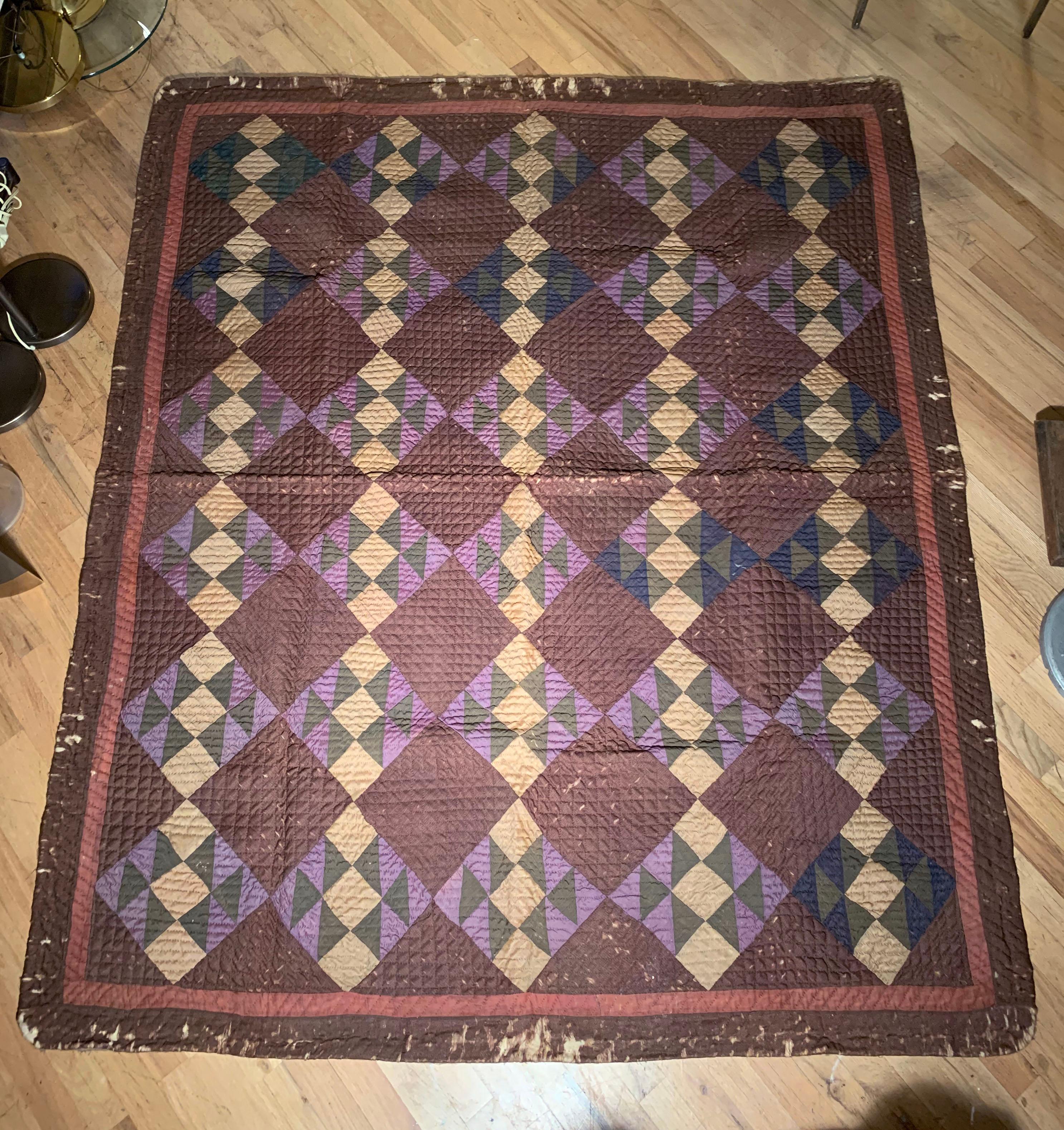 Beautiful old quilt attributed to the Amish. Very nice design and color pallet.
We believe this to be early 20th century.