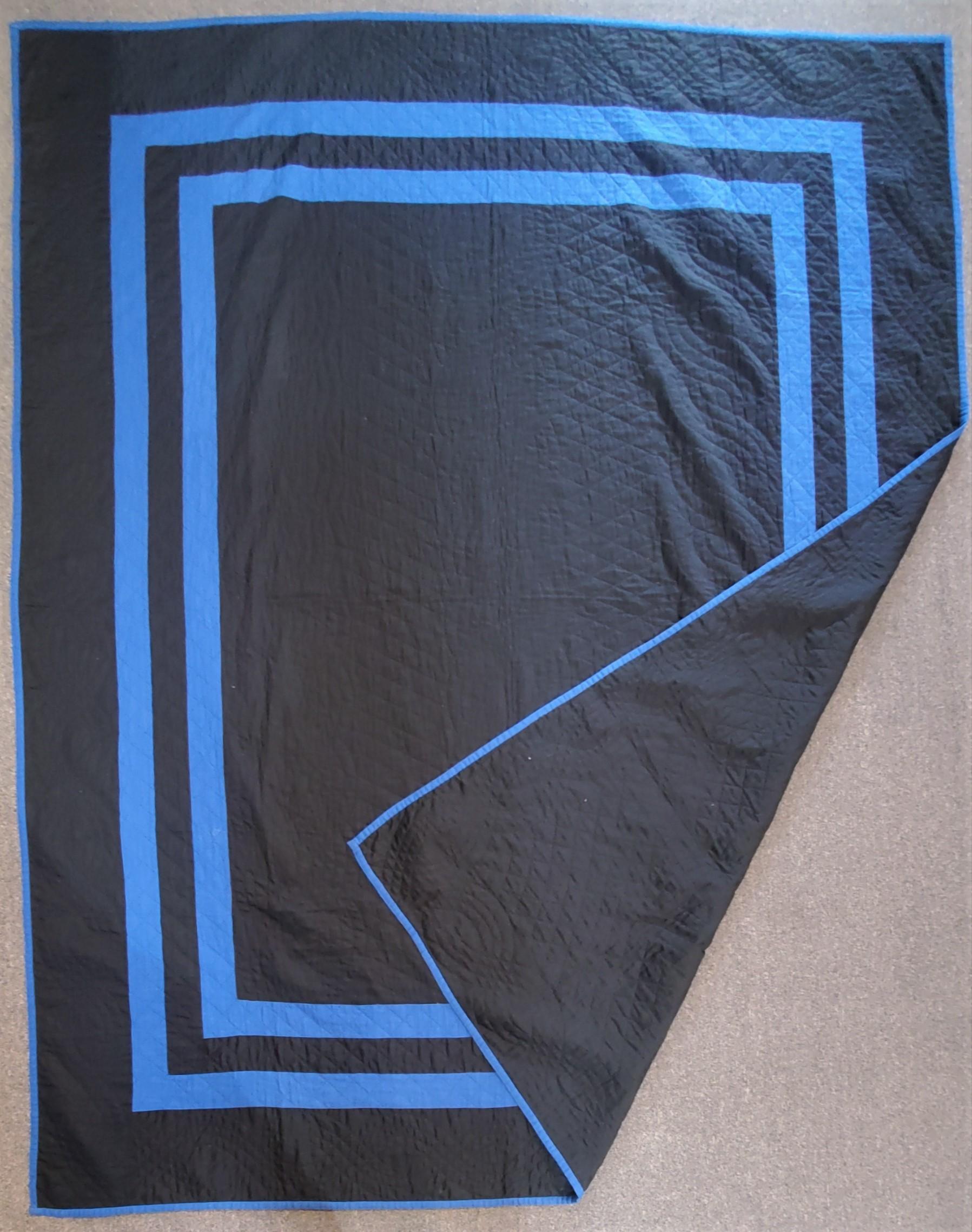 This fine black cotton sateen plain quilt is from Holmes County, Ohio and from the thirties. This finely quilted Ohio Amish plain quilt is in pristine condition and quite unusual.