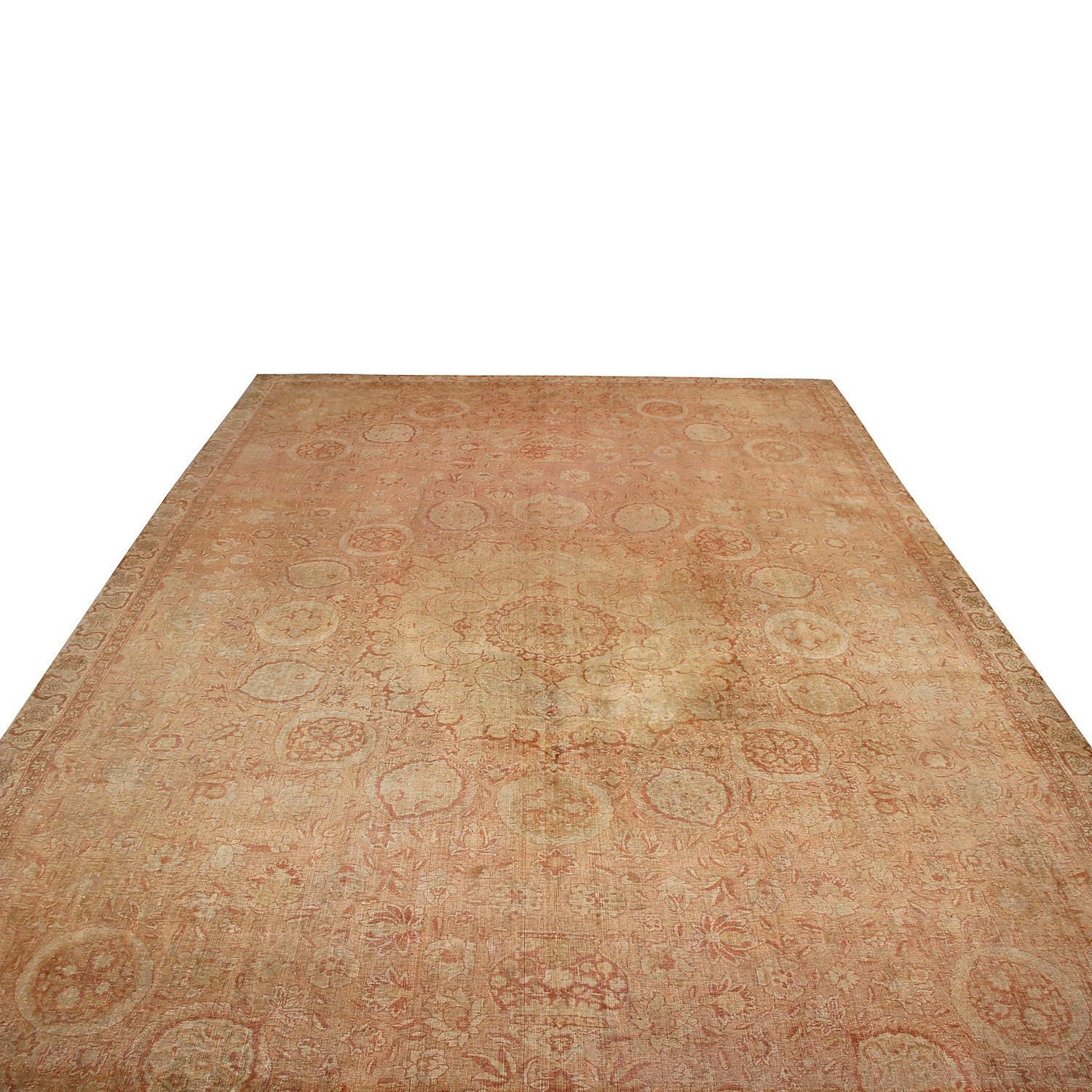 Hand knotted in India originating between 1890-1900, this antique Amritsar wool rug enjoys a marriage of traditional appeal with a distinct artisan finesse appealing to a variety of classic and transitional interiors. The meticulous attention to