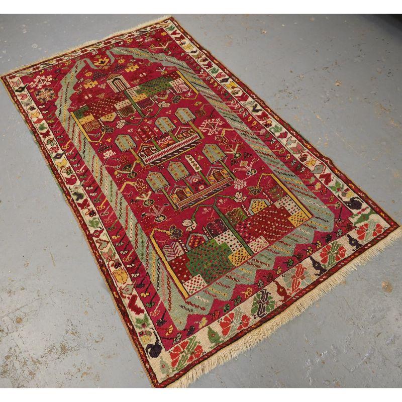 Antique Anatolian Kirsehir village prayer rug of traditional design.

An interesting pictorial prayer rug with trees and villages houses, this design is unique to the village of Kirsehir. The rug has a wide range of colours including soft blues,